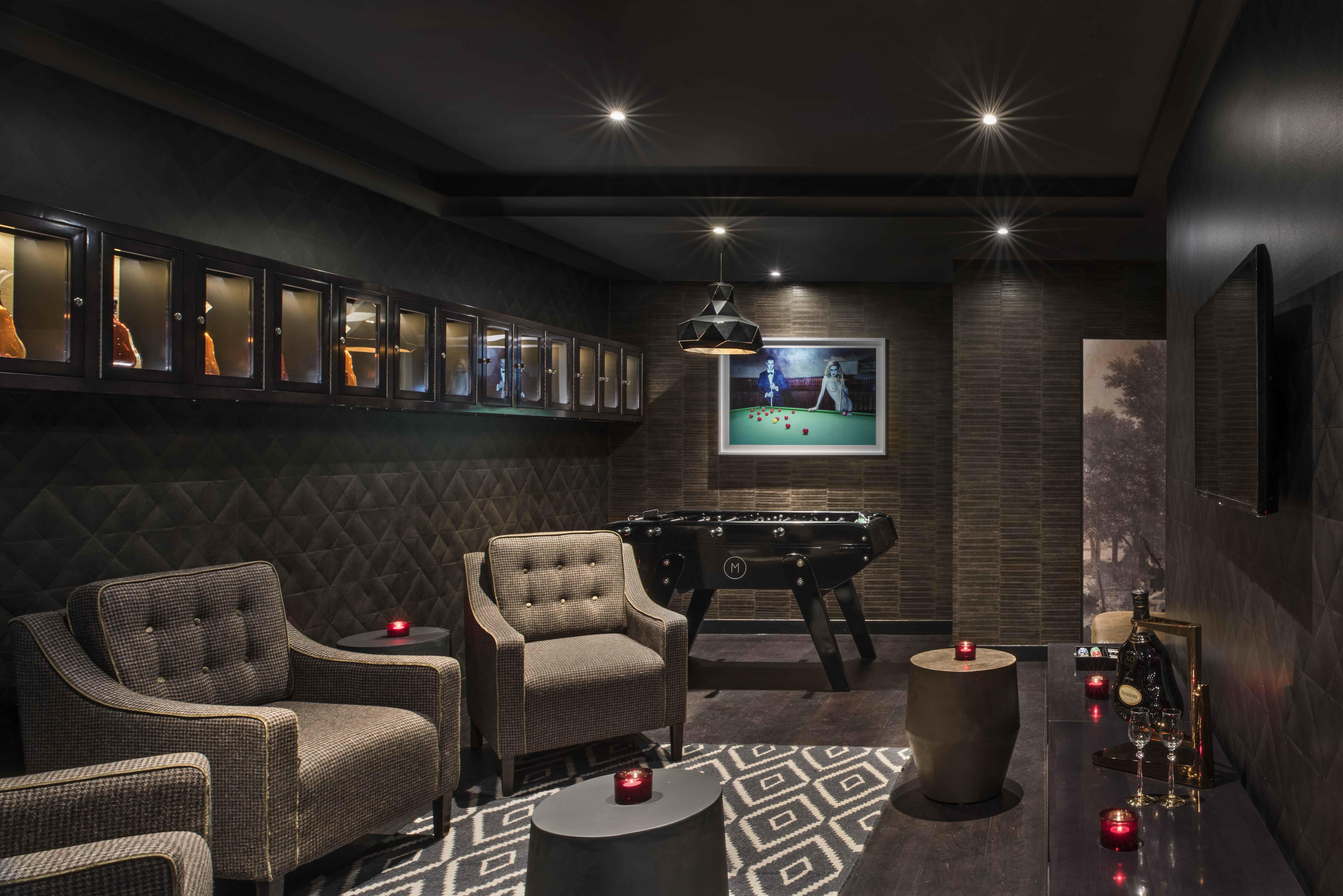 Stylish locker room lounge with cozy seating for networking events and meetings.