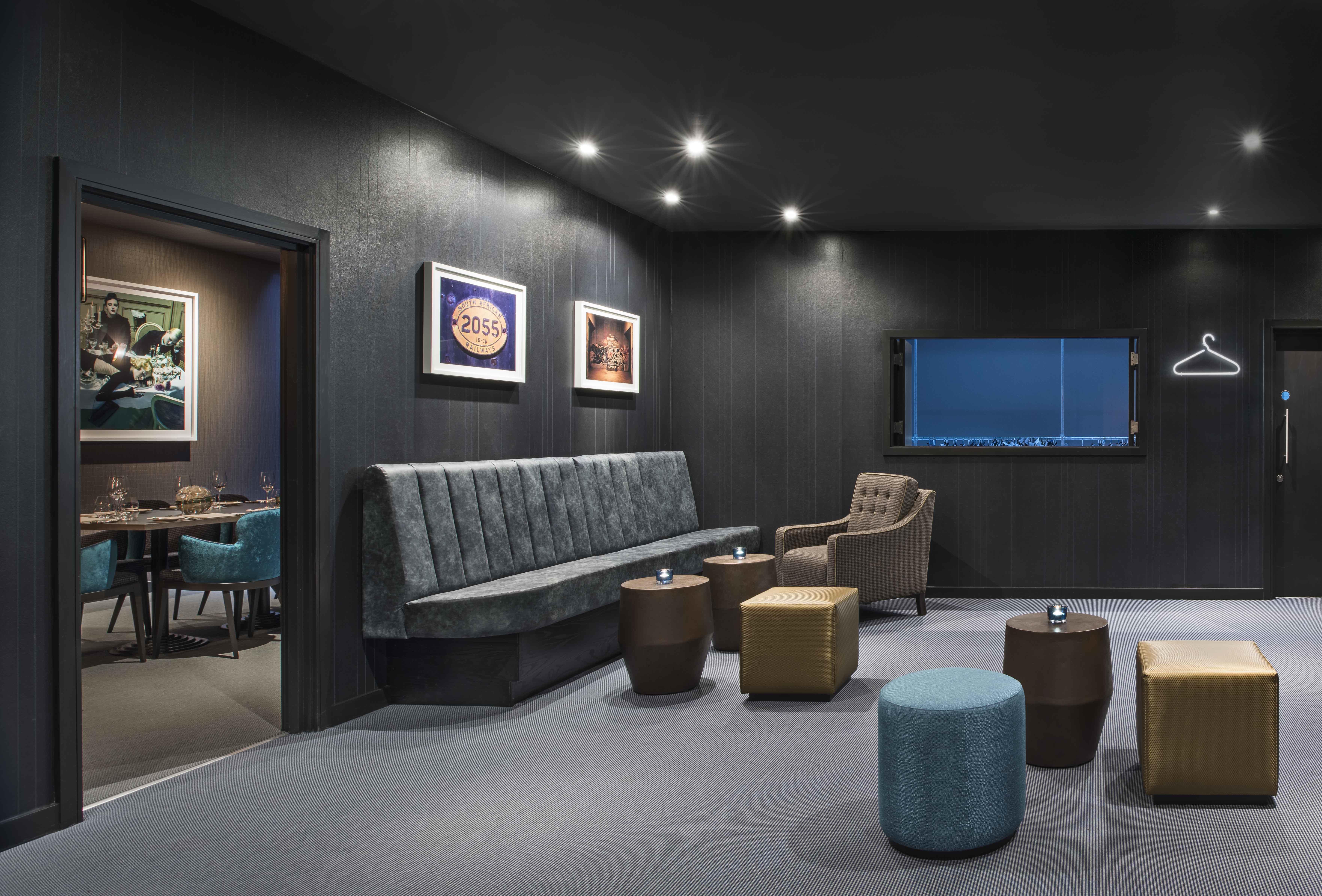 Modern underground meeting space with cozy seating for intimate gatherings.