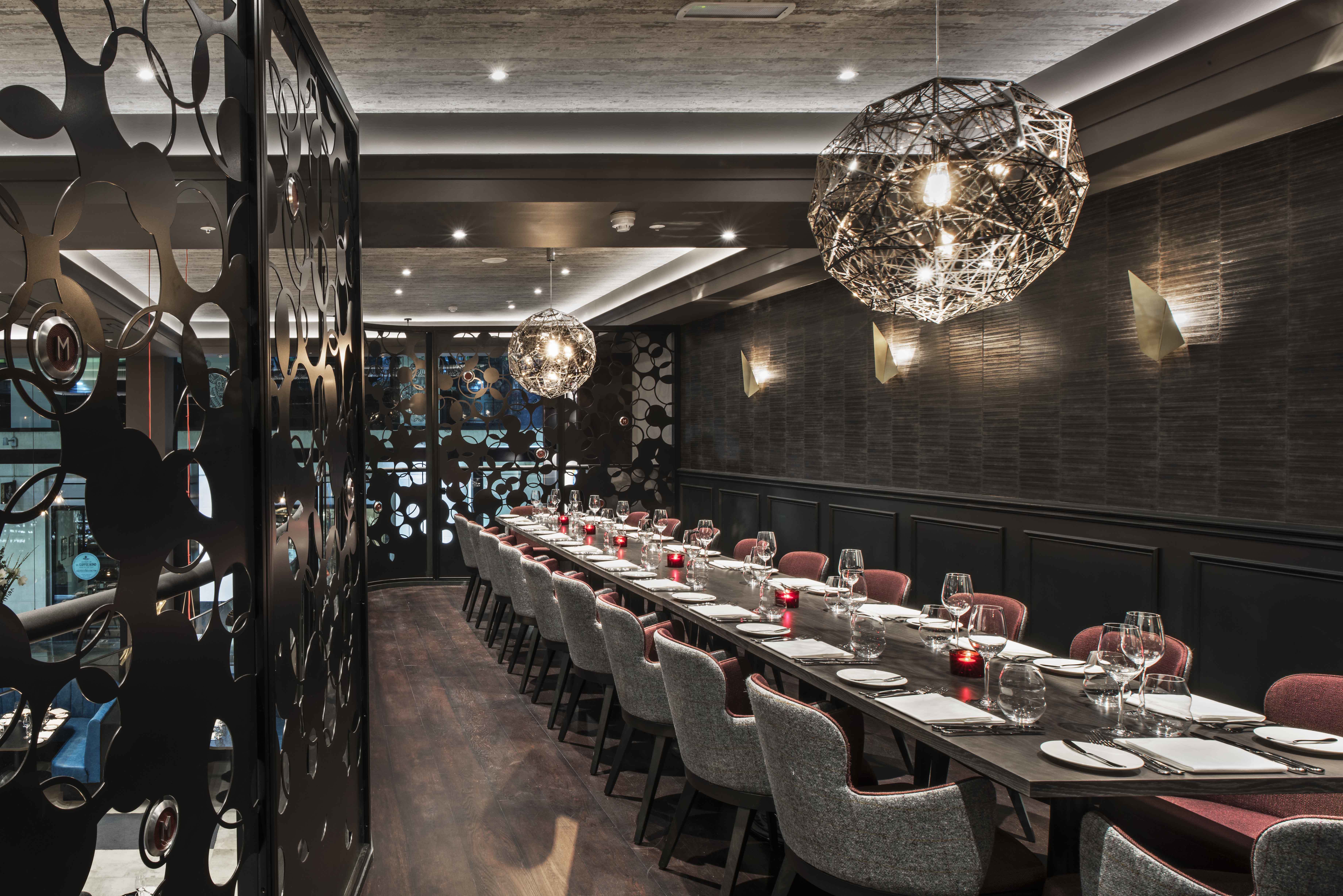 Modern dining space at GRILL PDR, ideal for corporate meetings and private events.