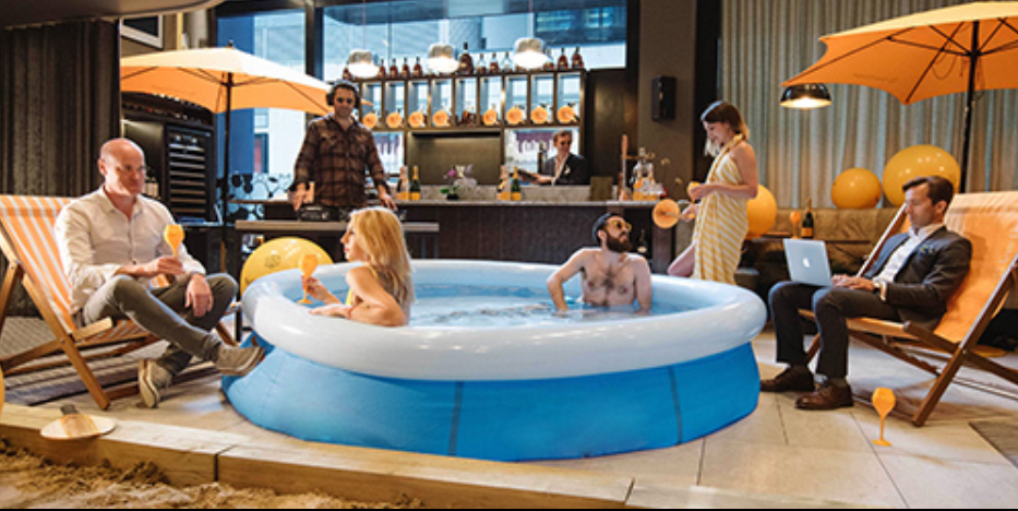 Vibrant poolside event setup at THE DEN, ideal for summer networking and gatherings.