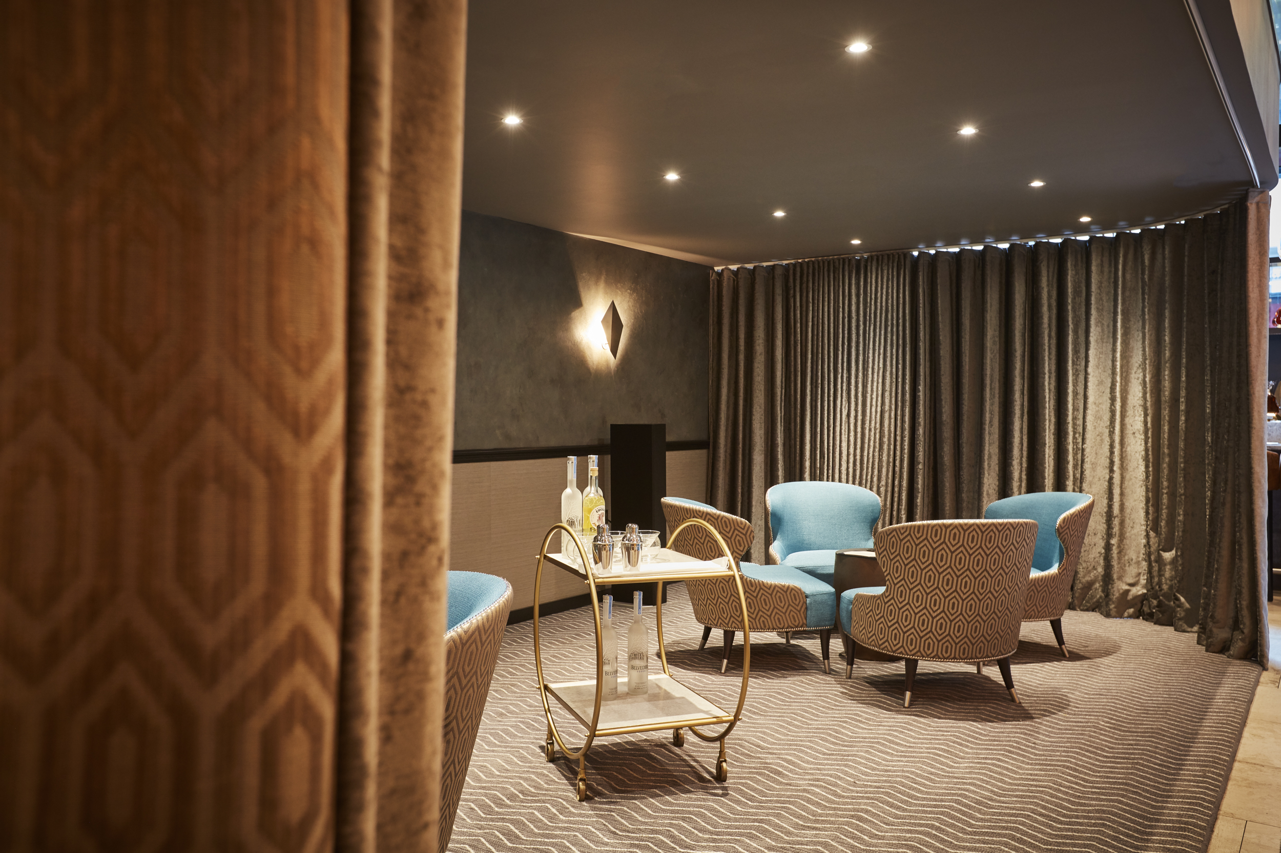 Stylish lounge at THE DEN, ideal for networking events with plush seating and refreshments.