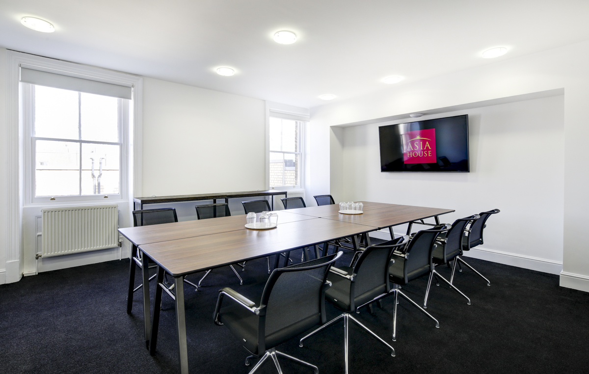 Modern boardroom in Asia House with large table, ideal for meetings and workshops.