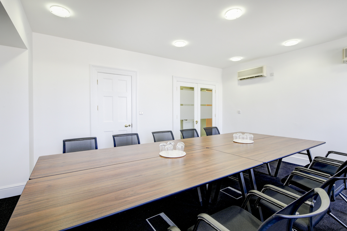 Modern boardroom in Asia House, spacious table for professional meetings and collaboration.