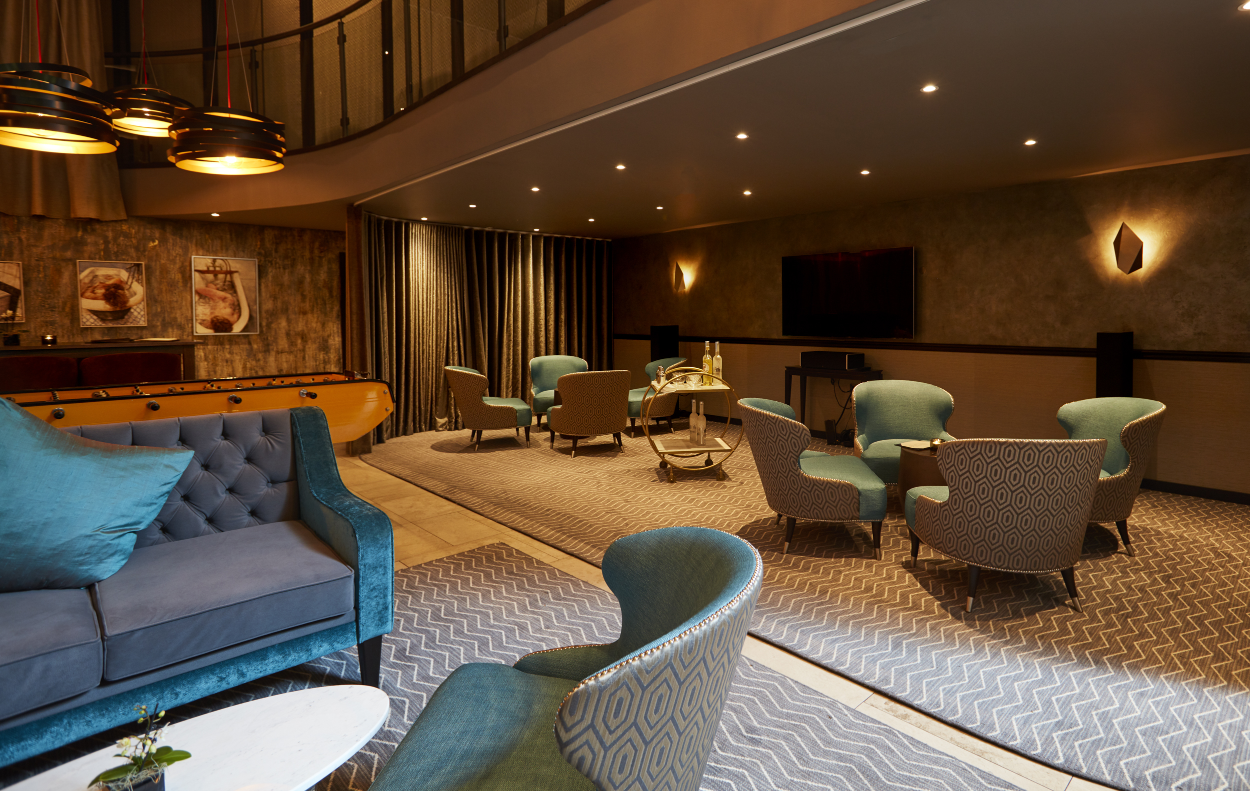 Stylish meeting space at THE DEN, ideal for networking events and intimate gatherings.