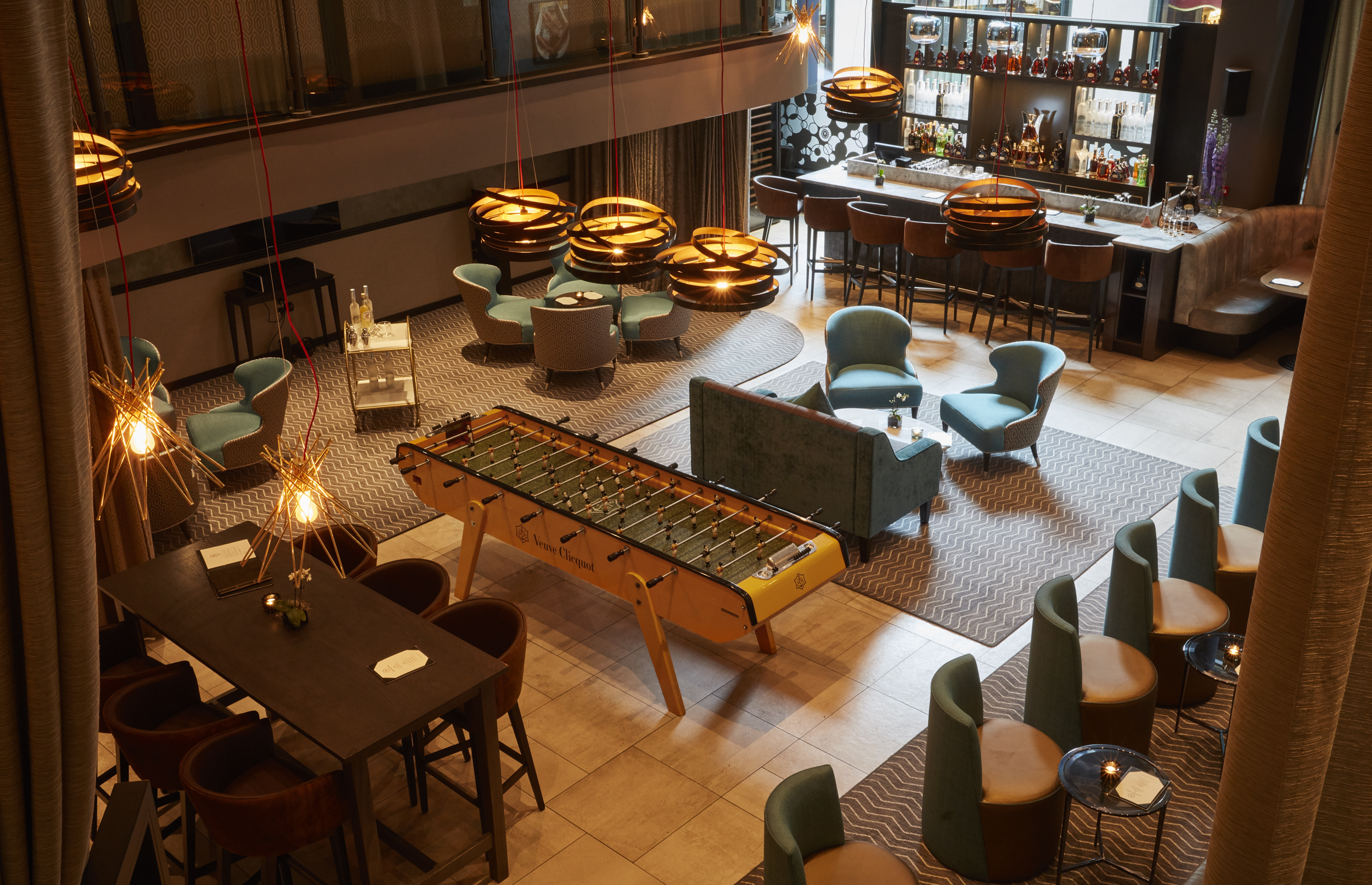 Modern lounge at THE DEN, featuring comfortable seating for networking events and meetings.