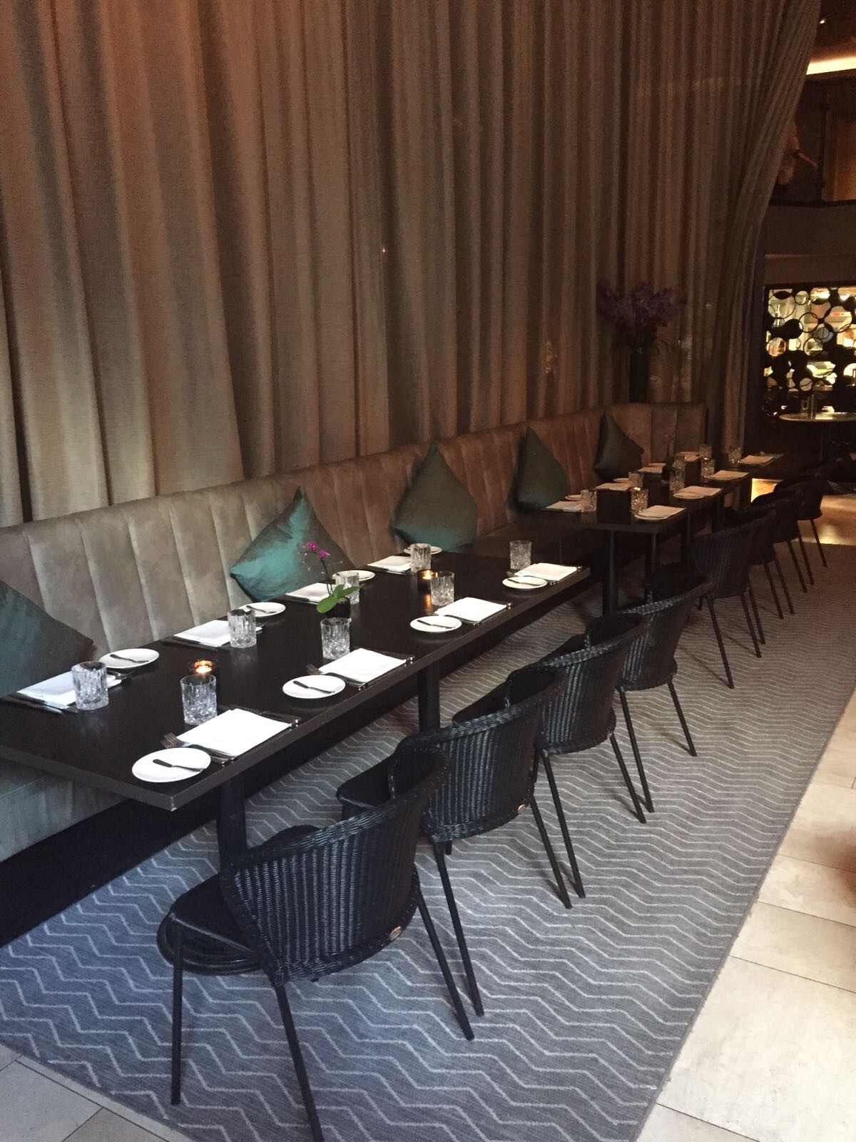 Stylish dining setup at THE DEN for intimate corporate dinners and networking events.