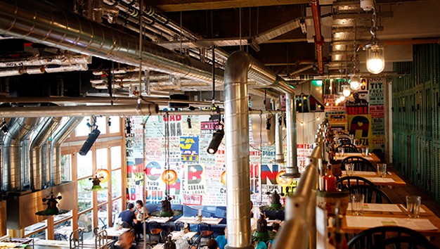 Vibrant industrial venue at The Rio Restaurant, perfect for casual meetings and events.