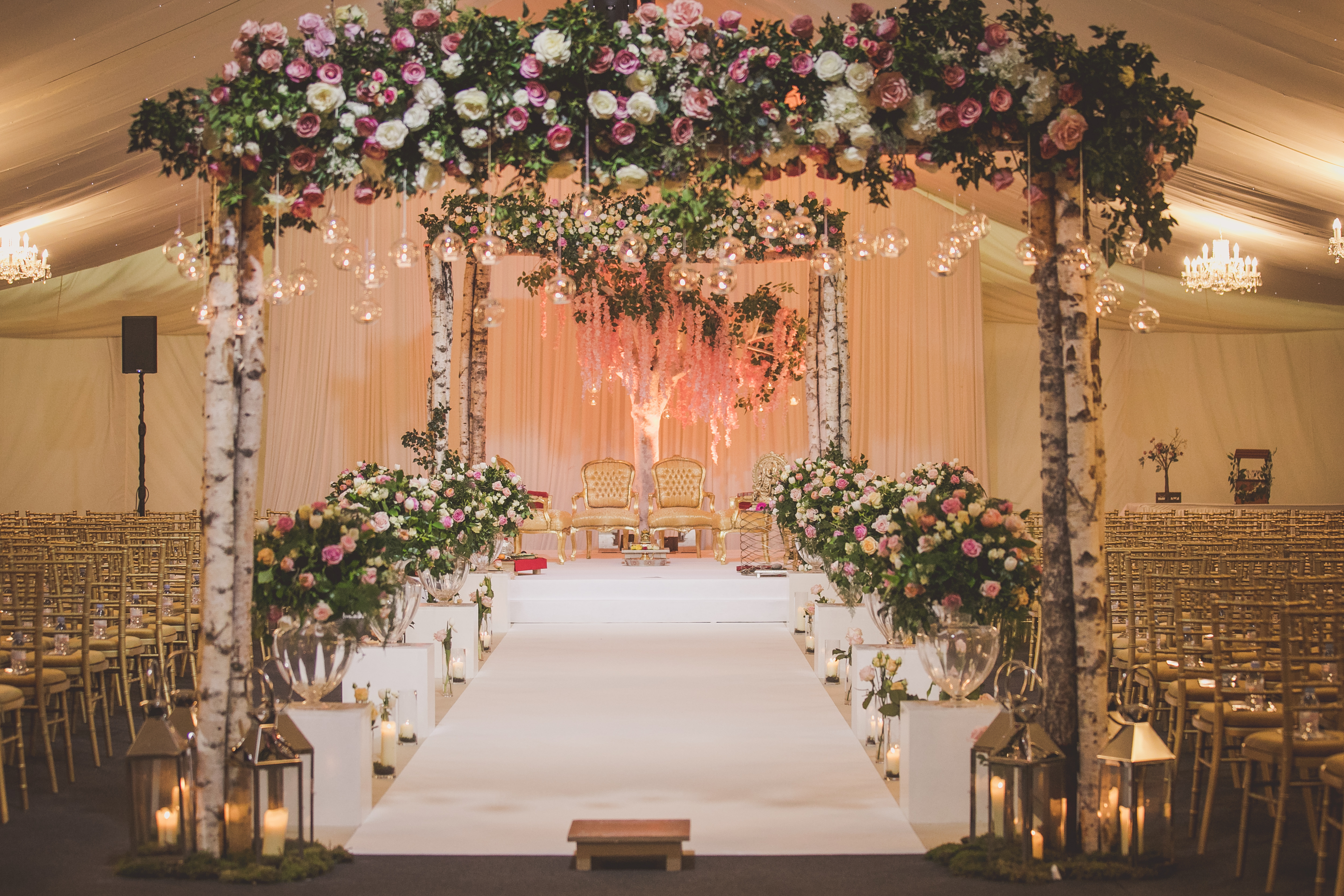 Garden Marquee at Hunton Park Hotel, floral archway for a romantic wedding ceremony.