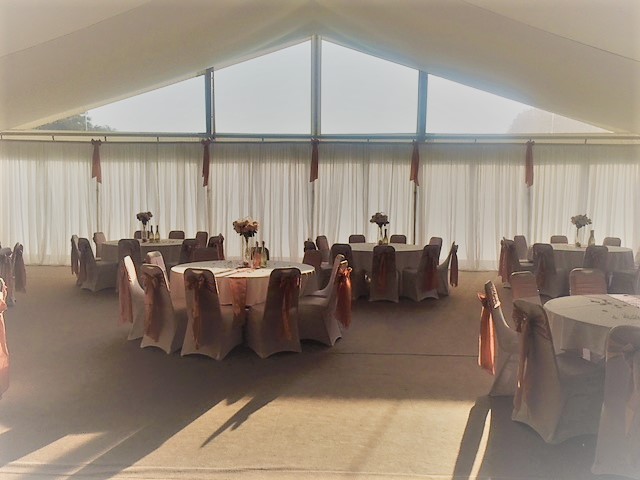 Elegant event space at Broome Park Hotel with floral centerpieces for weddings and gatherings.