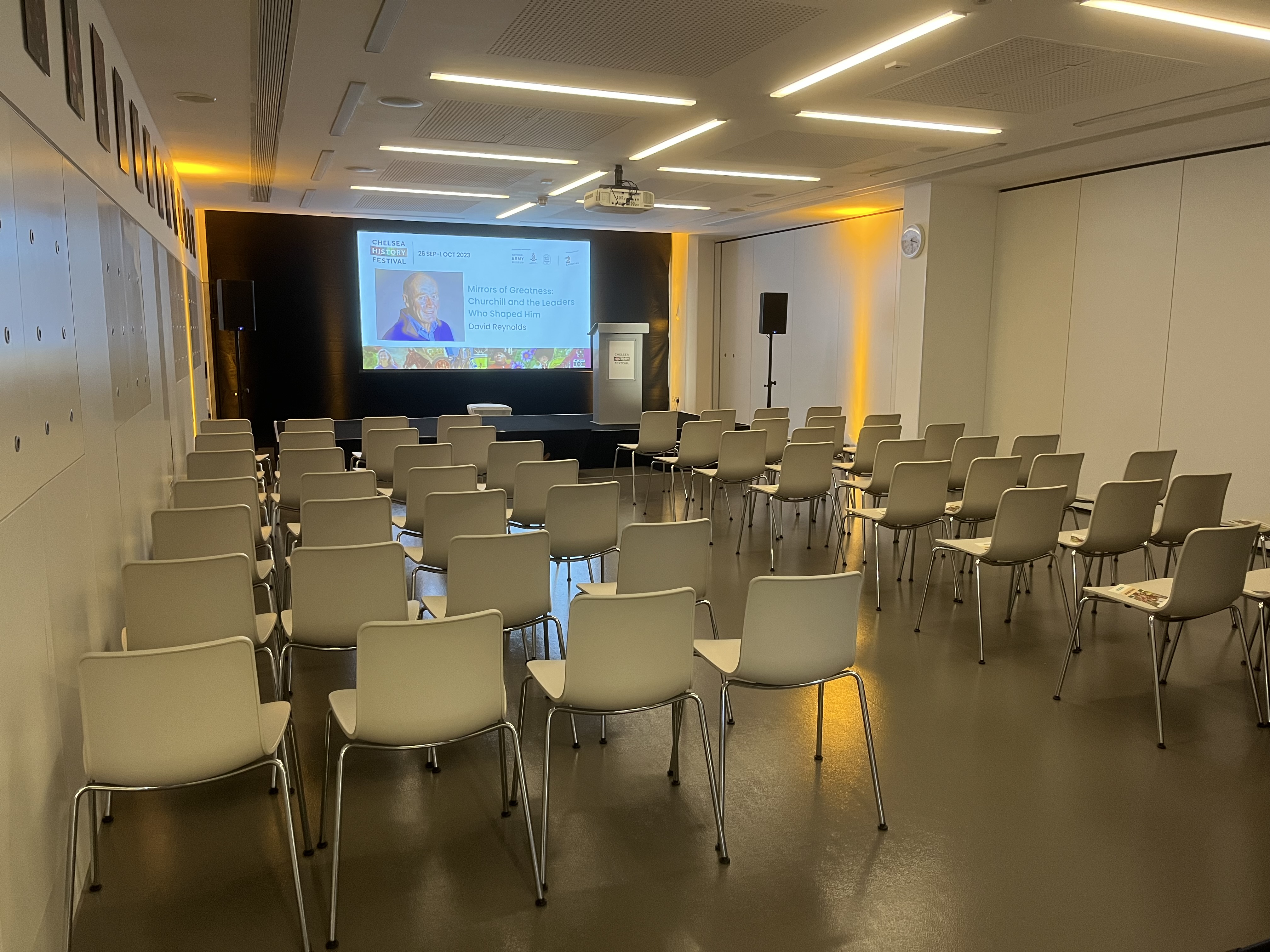 Foyle Centre meeting space with chairs and screen, perfect for seminars and workshops.