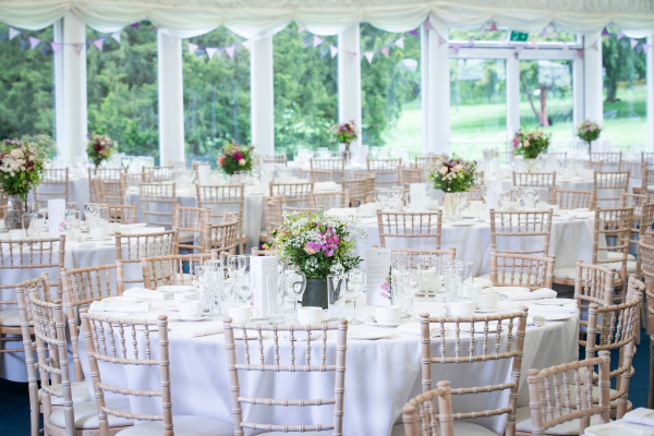Elegant event space at Hillsborough Castle with floral centerpieces, ideal for weddings.