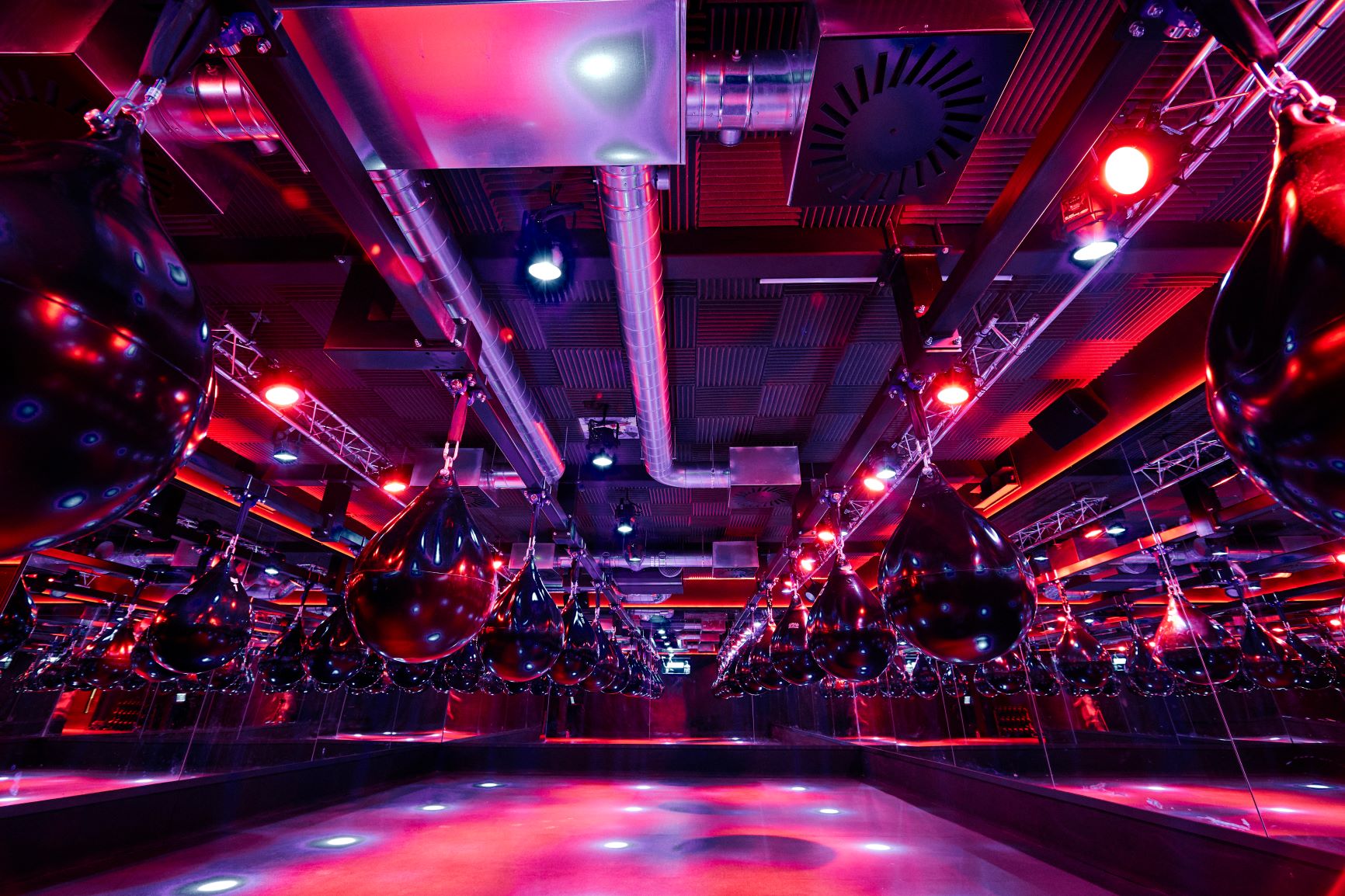 Dynamic event space with striking lighting for fitness and team-building activities.