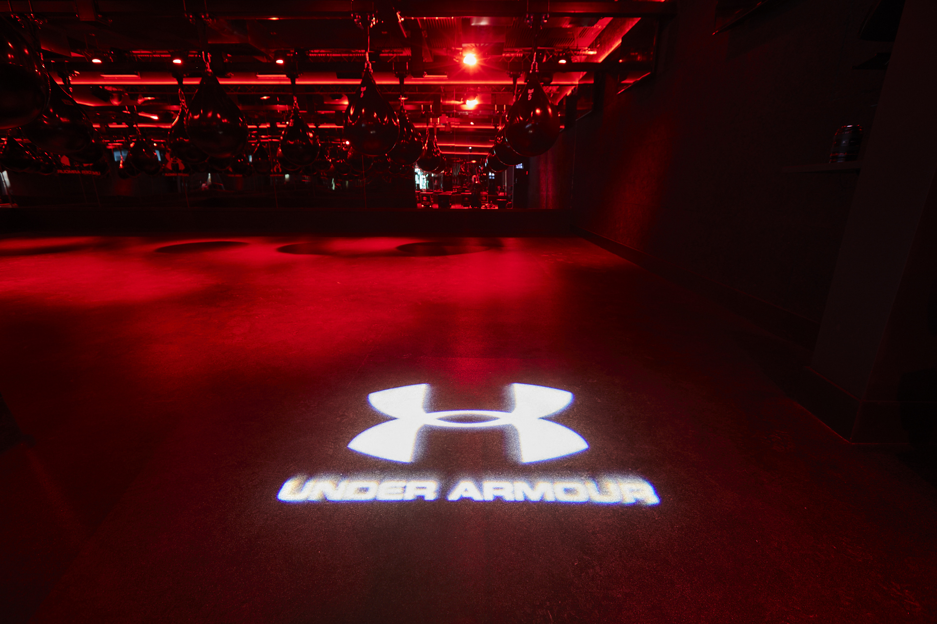 Dynamic event space with Under Armour logo, perfect for product launches and brand activations.