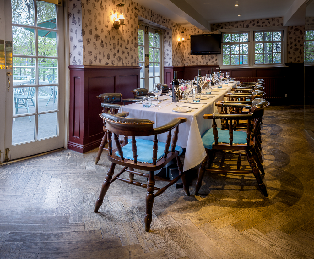 Elegant dining table at The Bridge, perfect for corporate meetings and intimate gatherings.