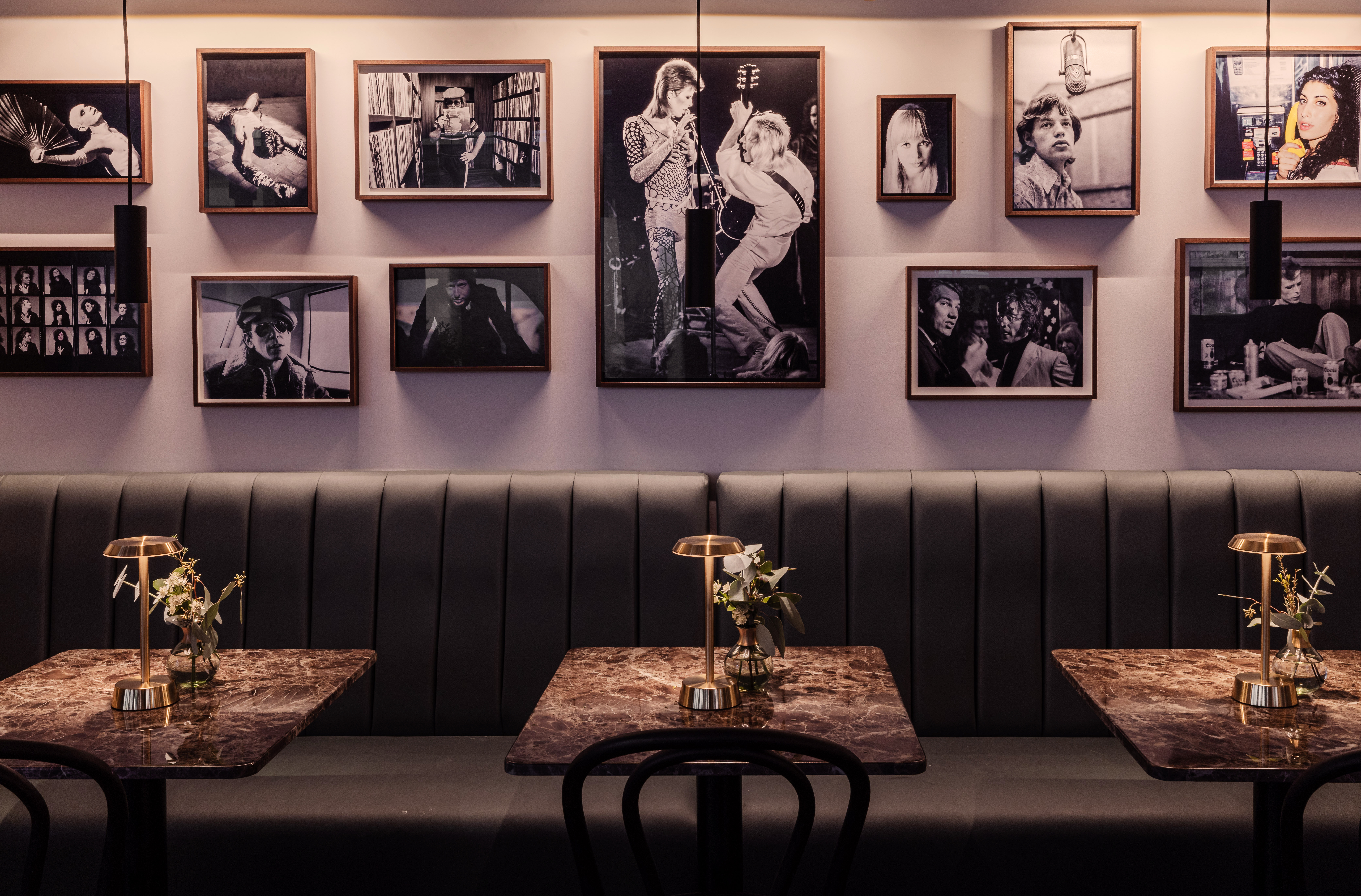 Stylish restaurant interior with gallery wall, perfect for networking events and gatherings.