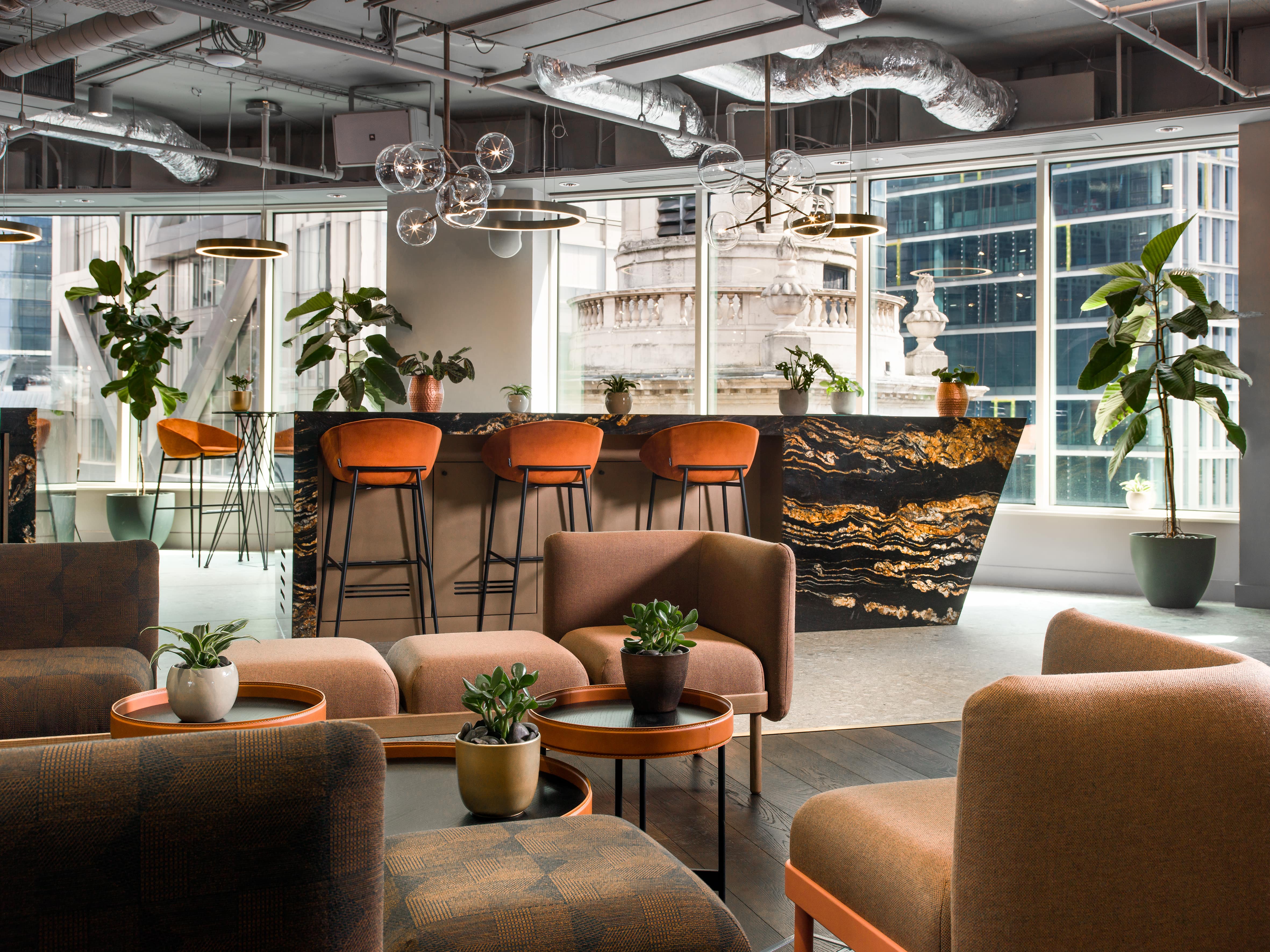 Modern event space at Cafe Lounge, Liverpool Street with natural light and lush greenery.