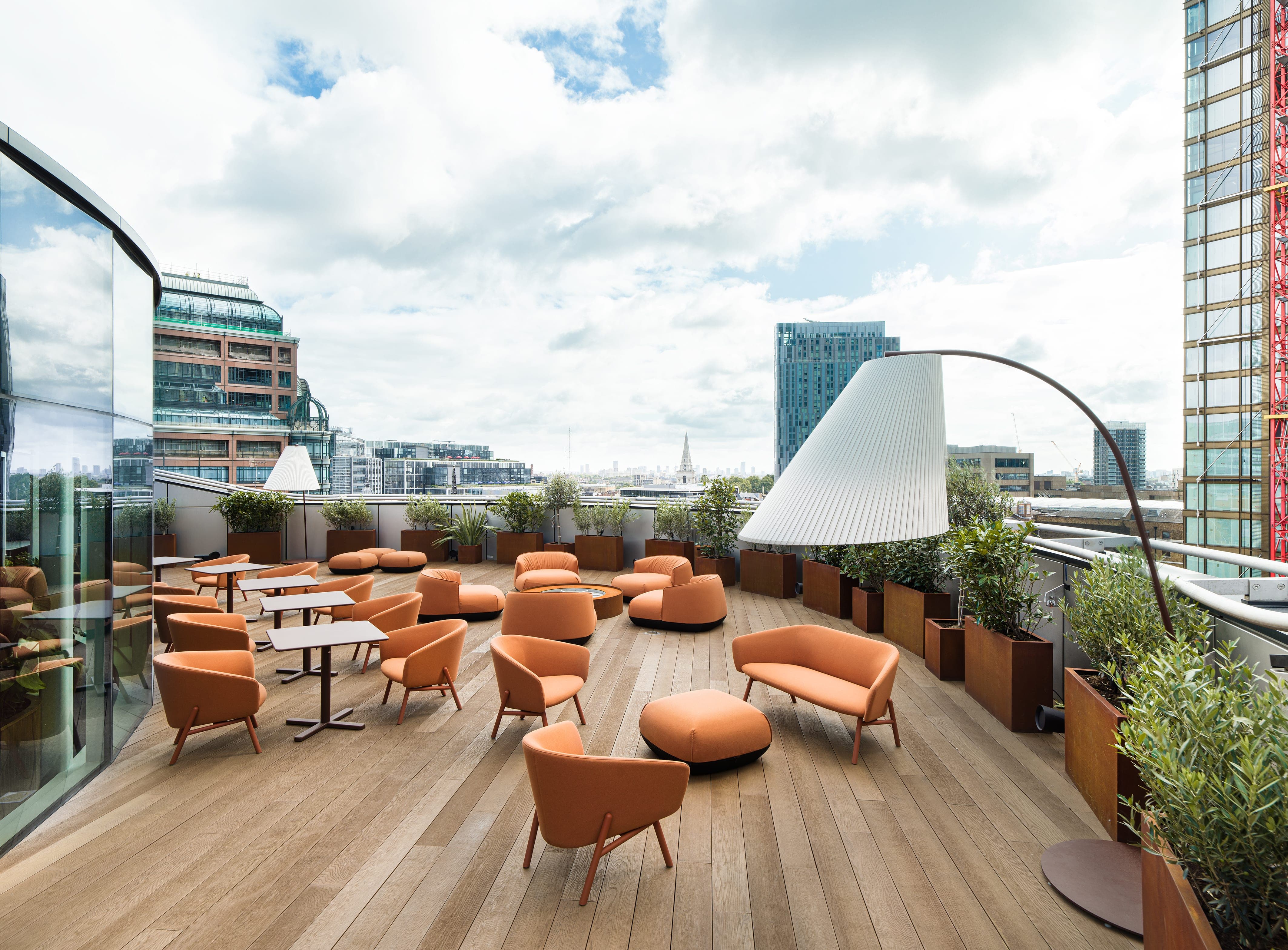 Stylish rooftop terrace with skyline view, ideal for networking and casual events.