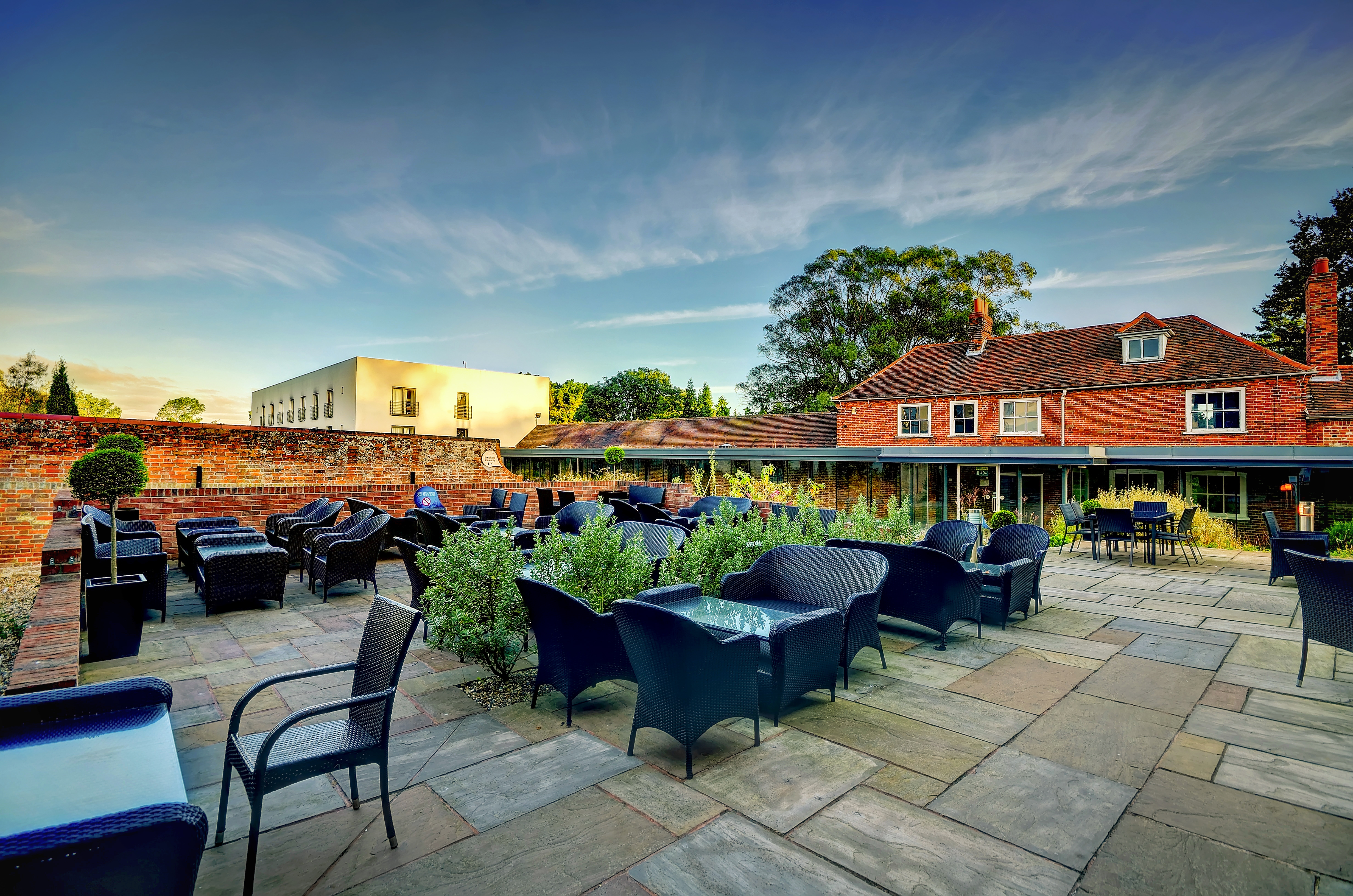 Cottage Boardroom at Lifehouse Spa: stylish outdoor event space with inviting seating.