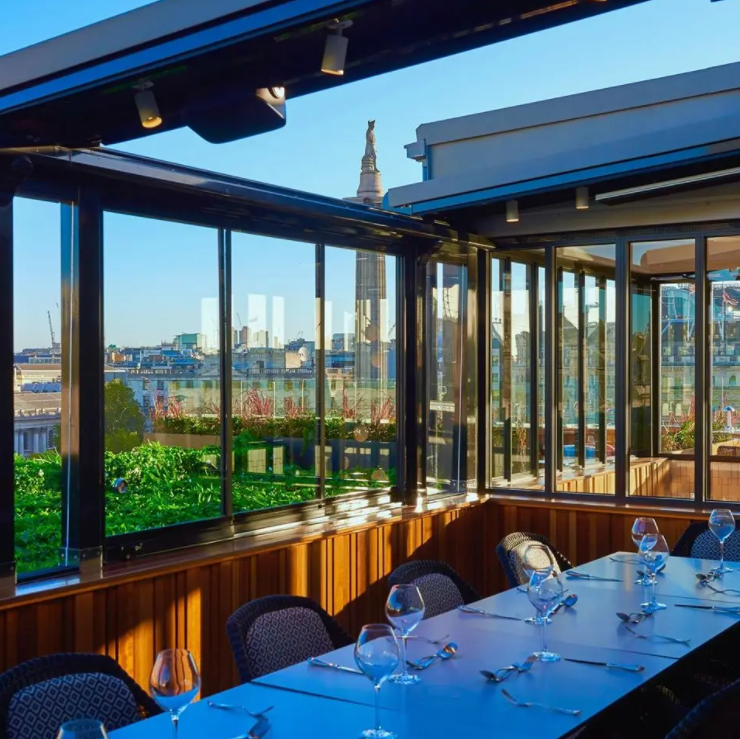 Stylish event space with skyline views, perfect for corporate meetings and social gatherings.