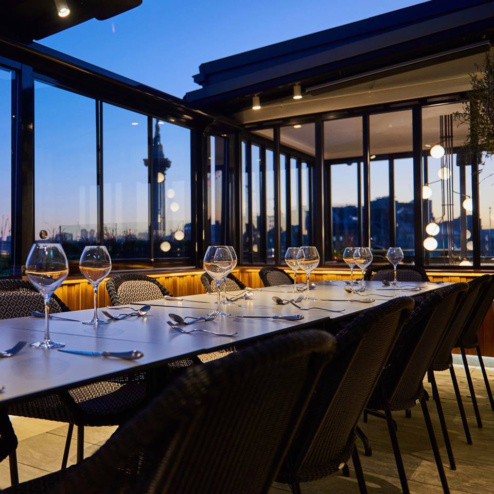 Sophisticated dining setup at The Rooftop ROOM, ideal for corporate events and celebrations.