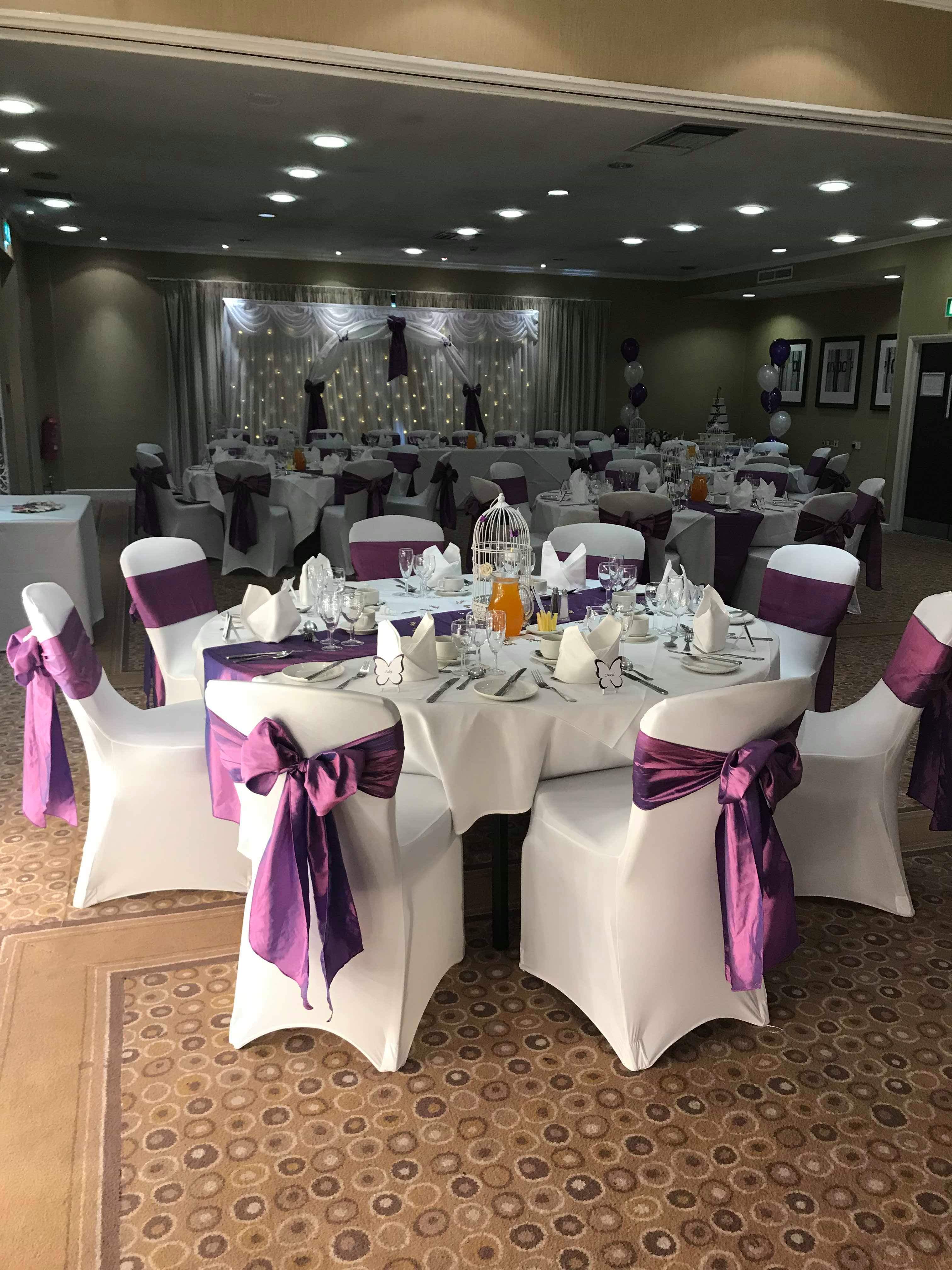 William Duesbury at Holiday Inn event space with elegant tables for weddings and gatherings.