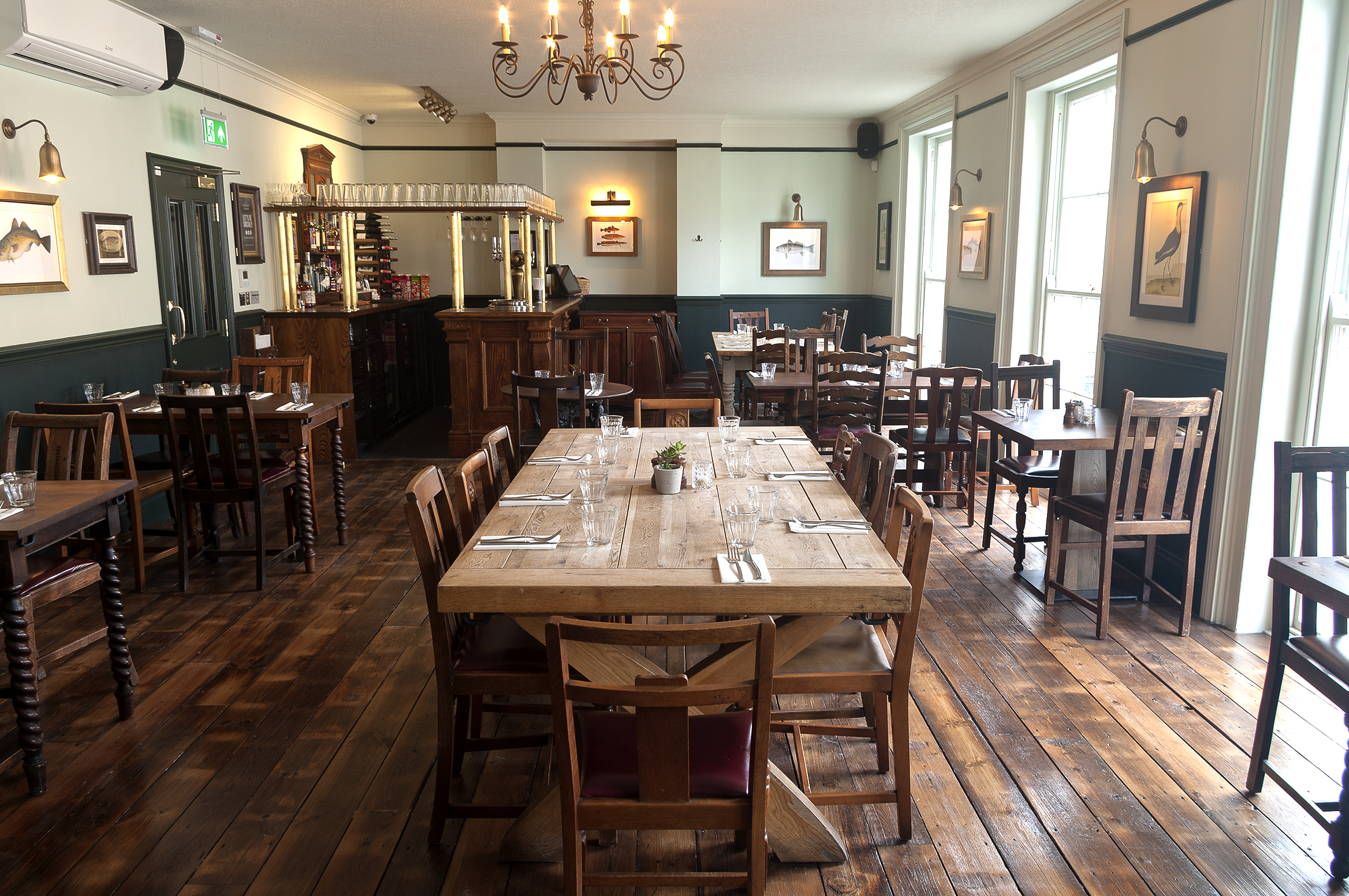 The Hardy Room at The Admiral Hardy: warm wood dining space for events and gatherings.