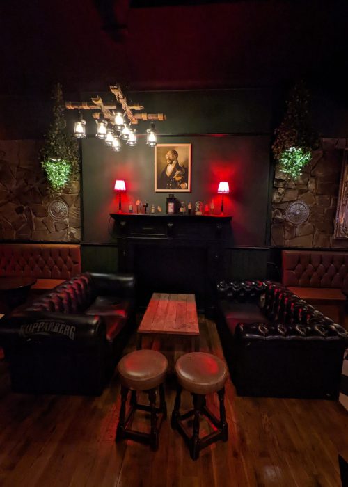 Cozy lounge at The Macbeth with vintage decor, ideal for networking events and gatherings.