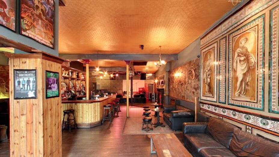 Main bar at The Macbeth: inviting event space with eclectic decor for gatherings.