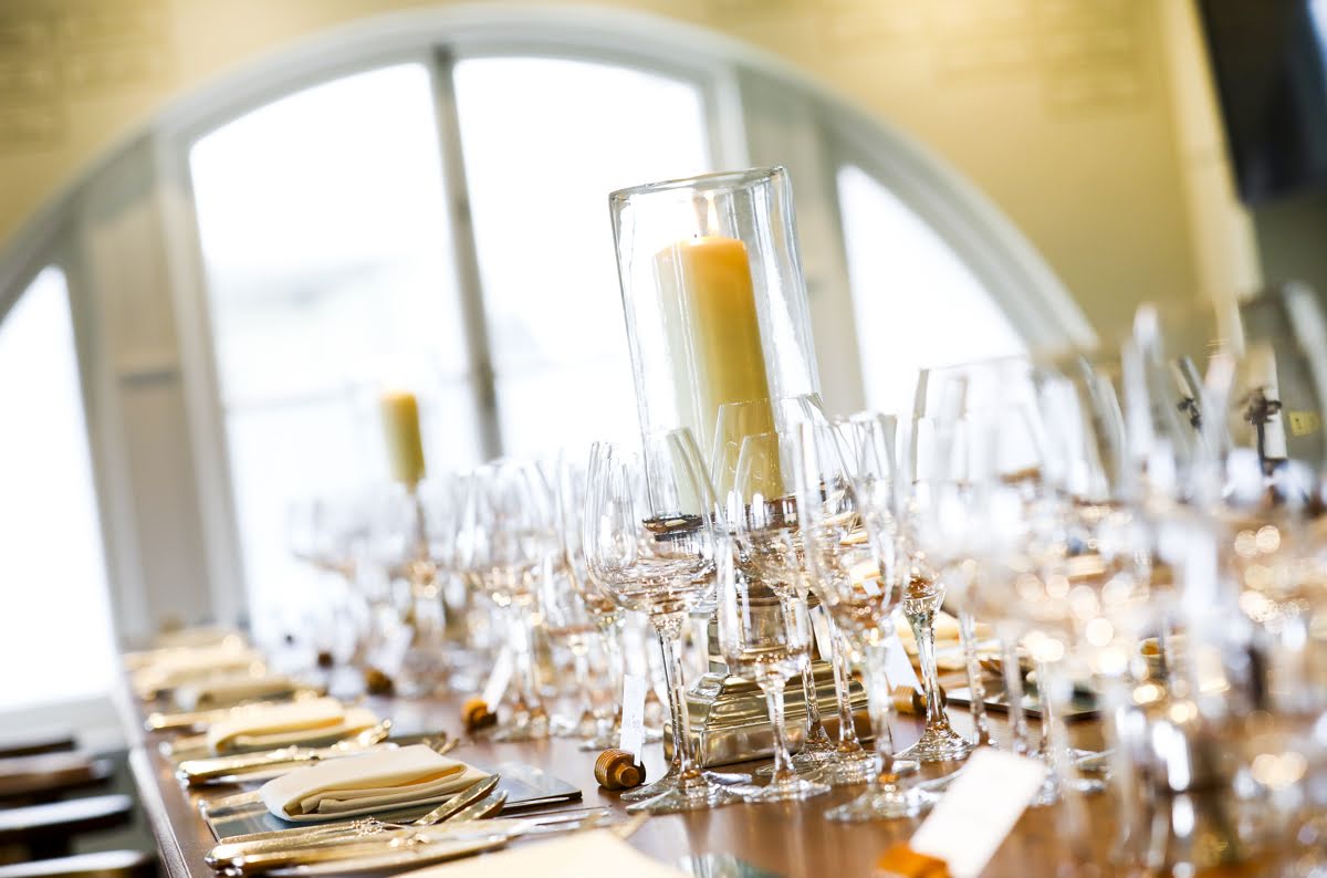 Elegant dining table with candle at Lord's Cricket Ground for formal events.