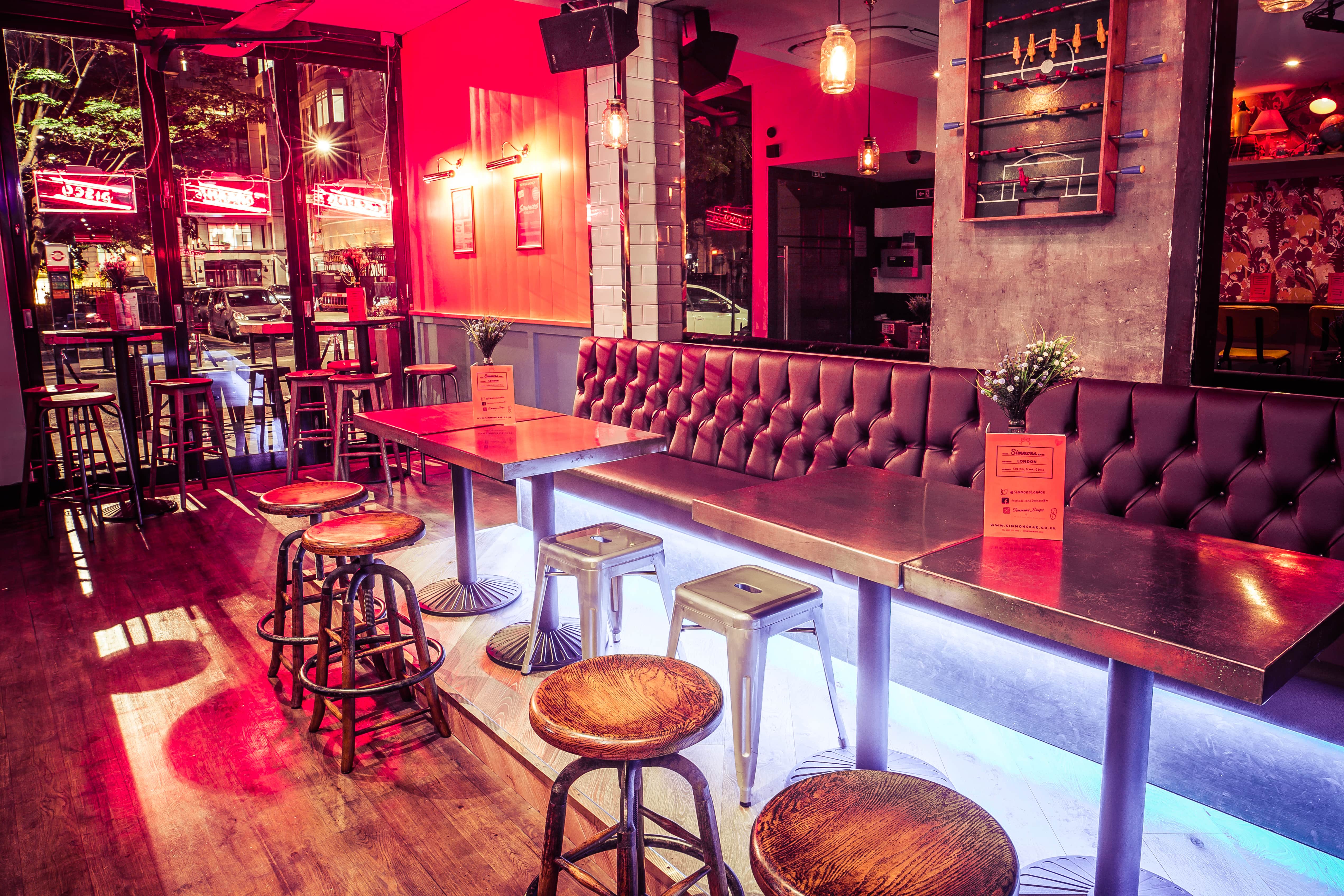 Vibrant Simmons Piccadilly Circus venue with cozy booths for casual meetings and events.