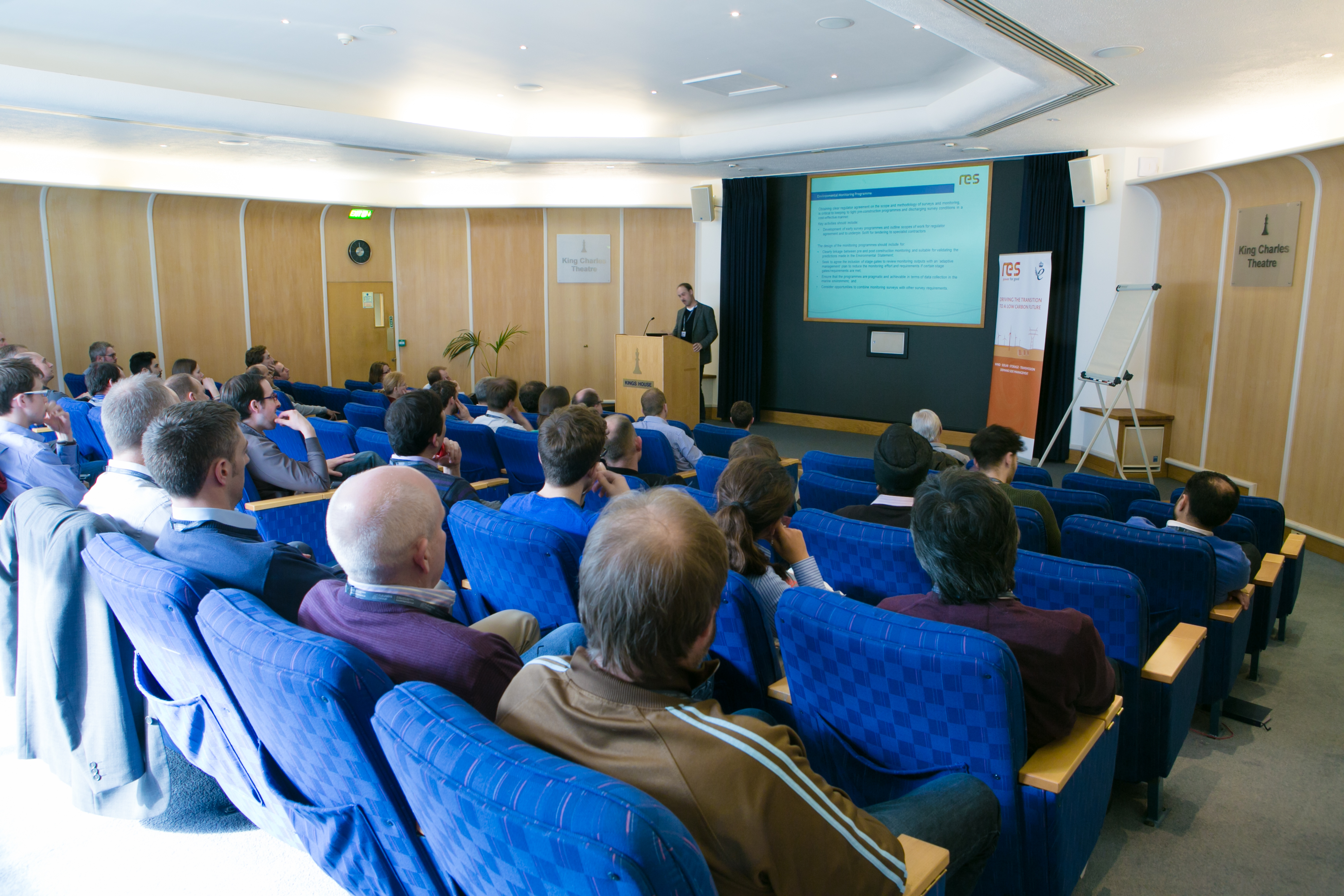 King Charles Theatre conference with speaker, tiered seating for effective presentations.