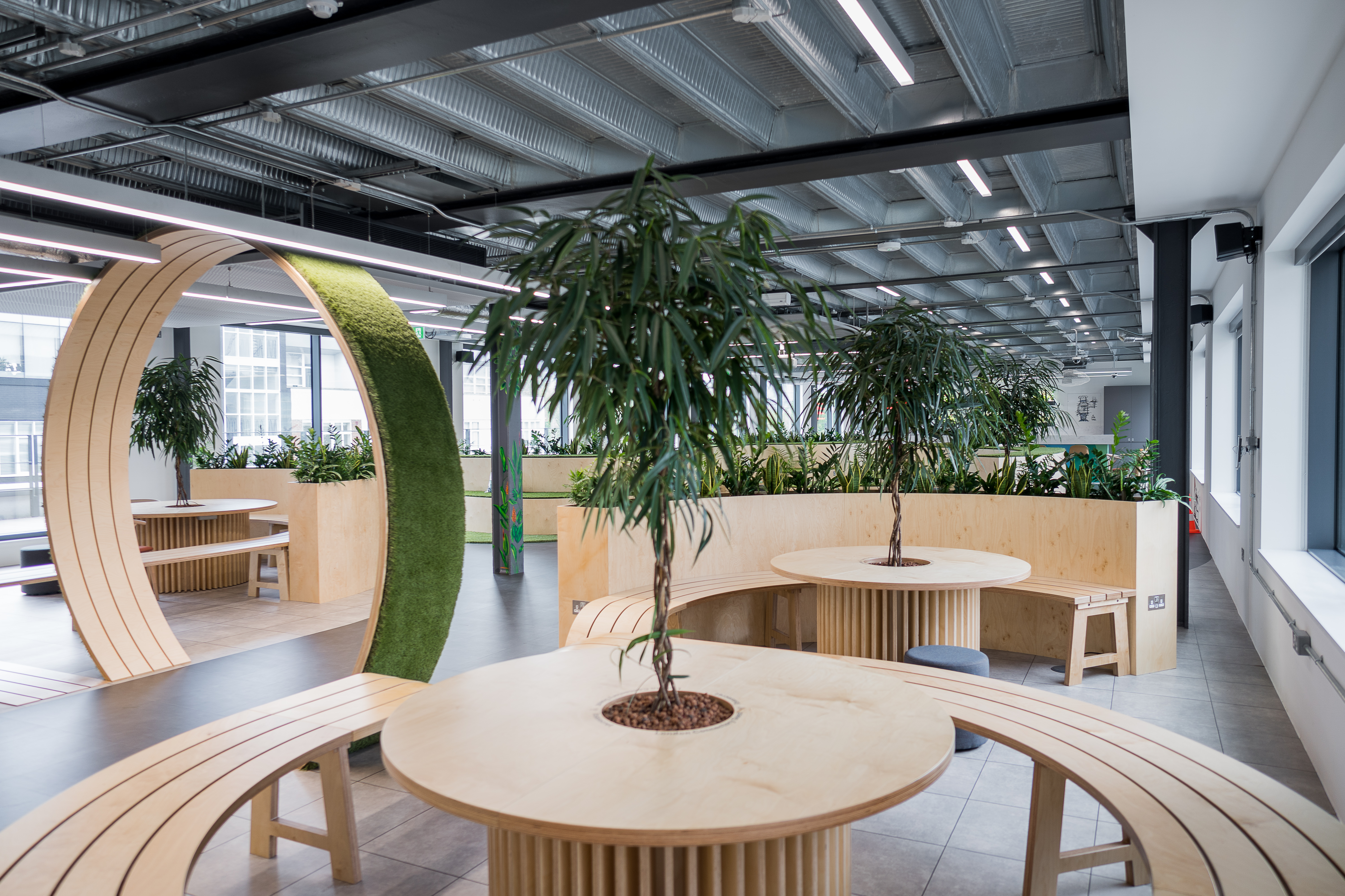 Modern meeting space in London with circular seating for collaborative events.