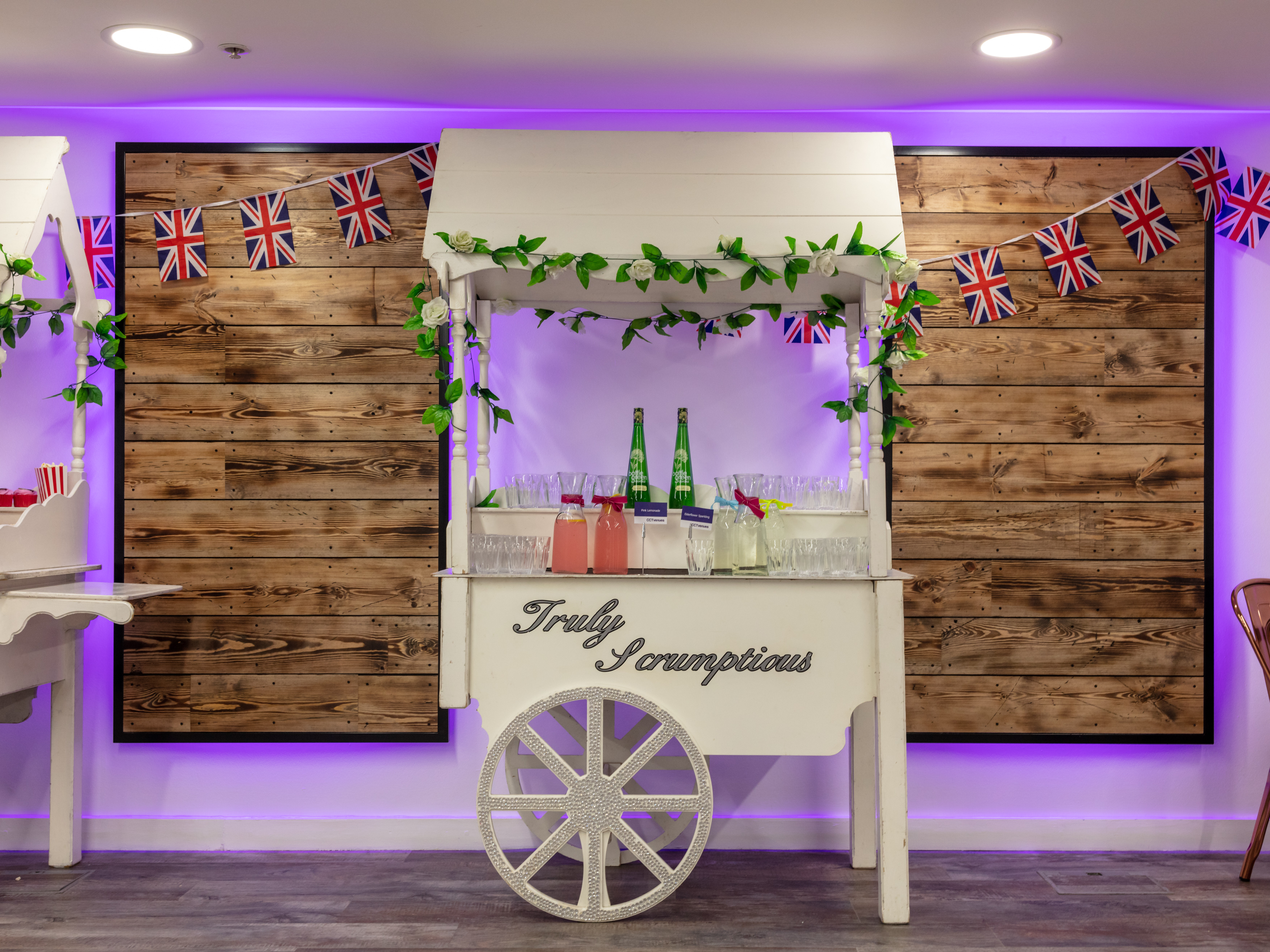 Beverage cart with greenery in Smithfield Suite, ideal for events and celebrations.