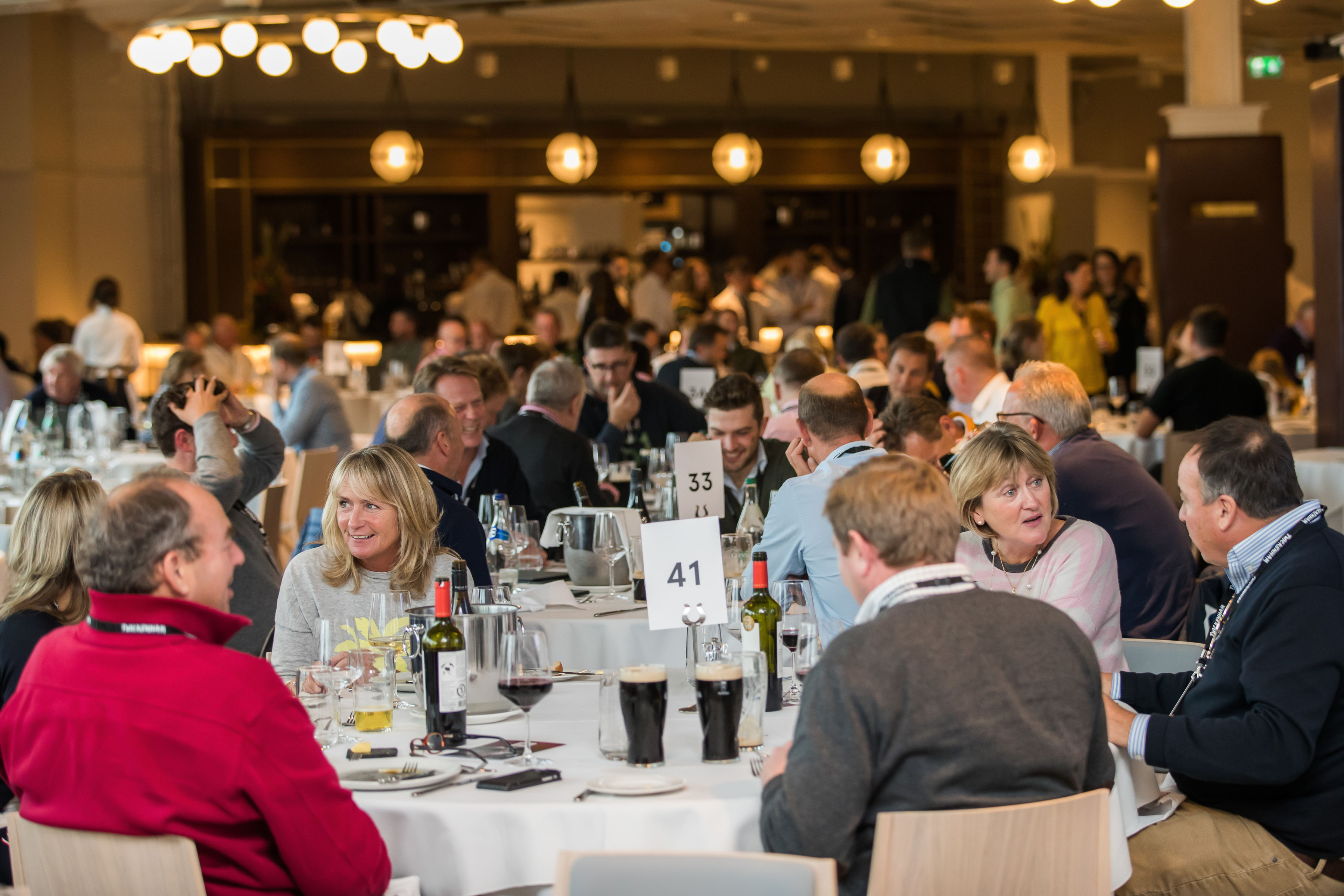 Networking event at Allianz Stadium, Twickenham with elegantly set tables and engaged attendees.