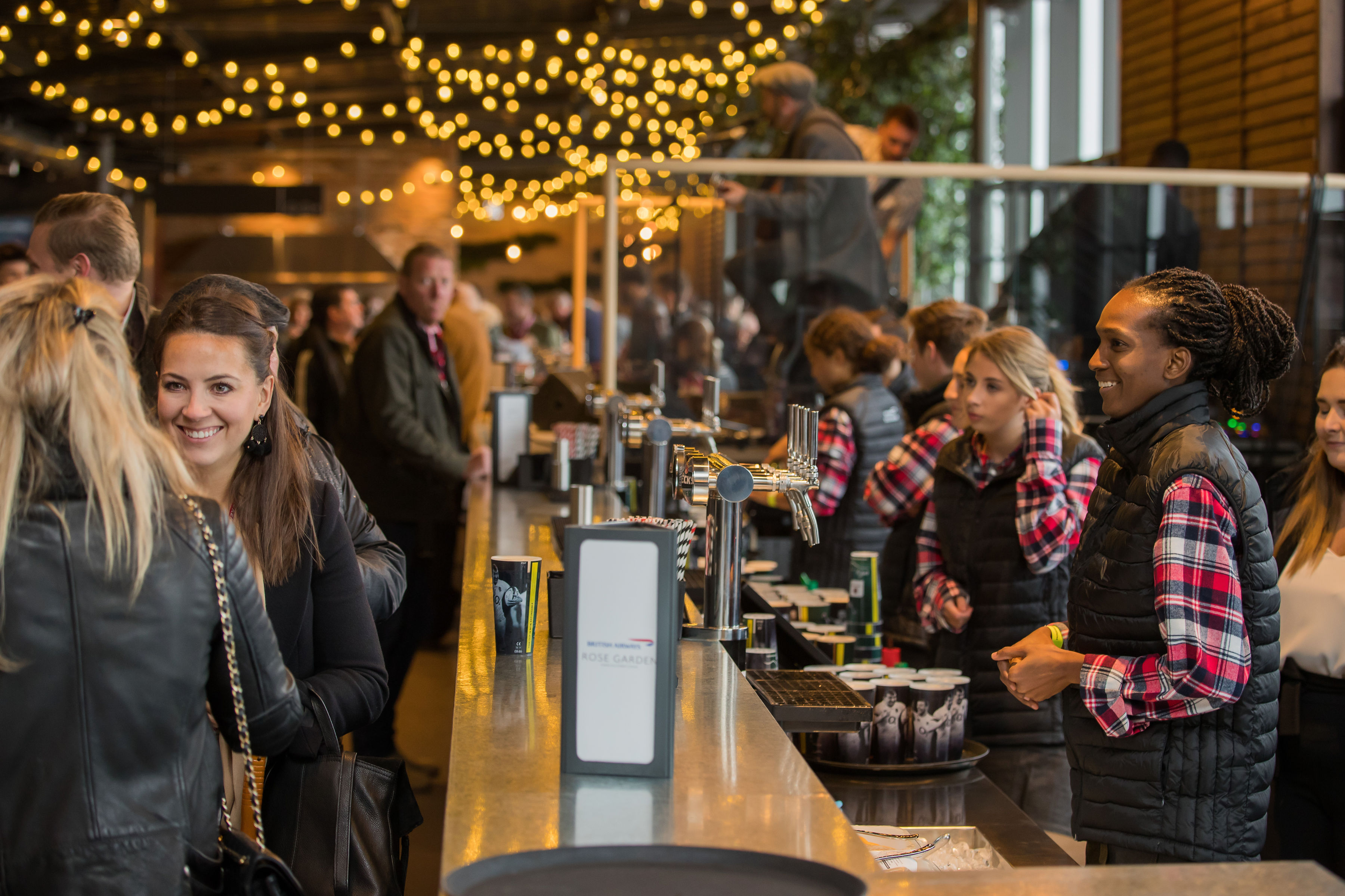 British Airways Rose Garden at Allianz Stadium, Twickenham - vibrant networking event with string lights.