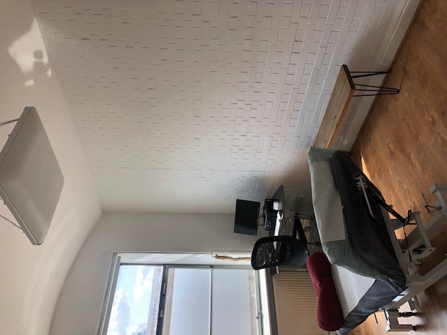 Minimalist meeting space with natural light at Marcophysio Westferry for events and collaboration.