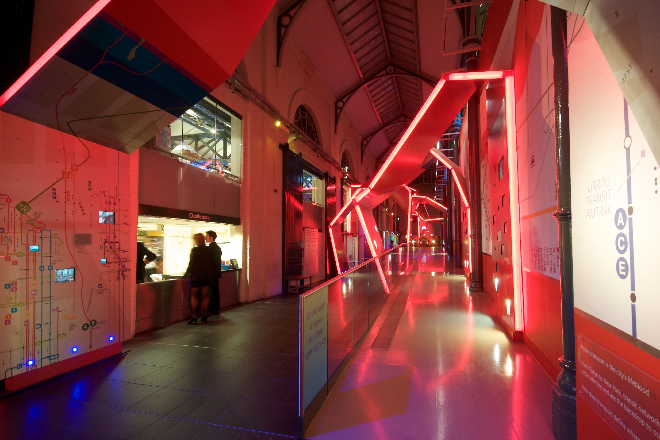 London Transport Museum event space with red lighting, ideal for networking and exhibitions.