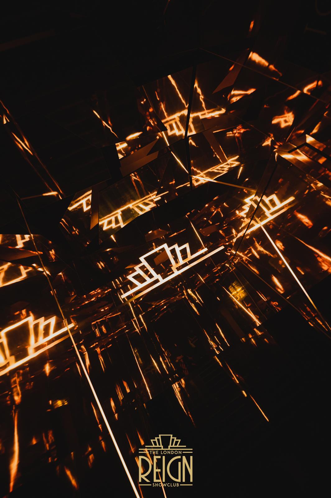 The Mezzanine in London Reign: modern event space with mirrored surfaces and geometric designs.