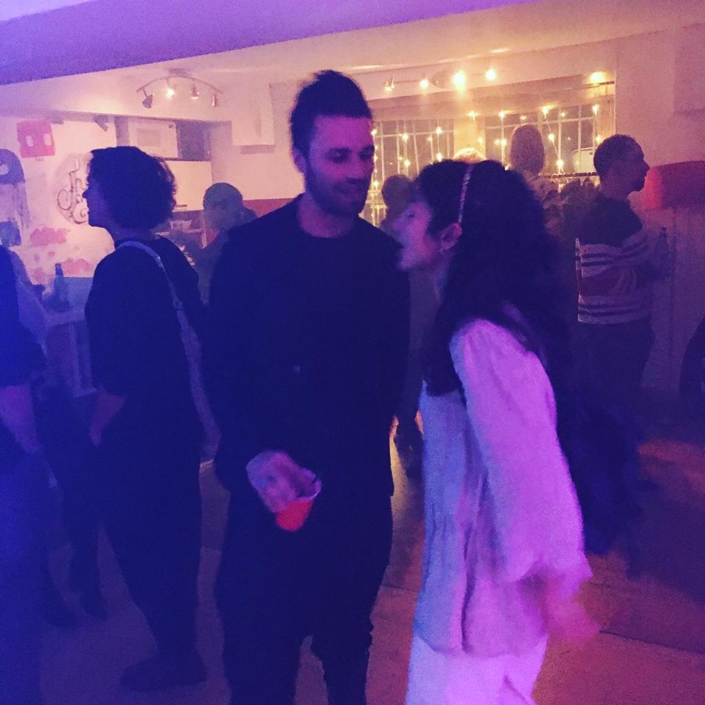 Vibrant networking event at Dalston Den with ambient lighting and lively atmosphere.