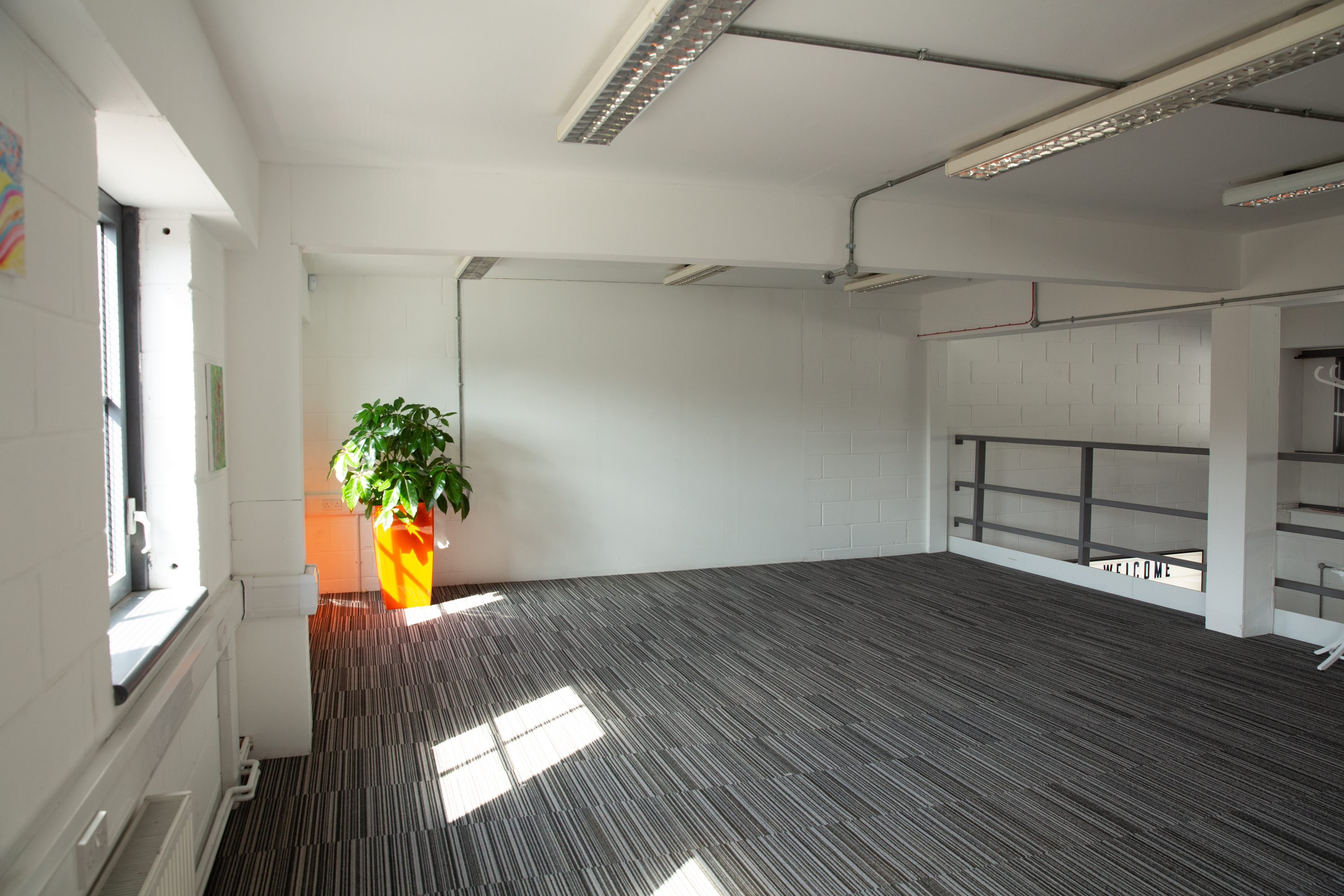 Whole Mezzanine event space with natural light, ideal for workshops and gatherings.