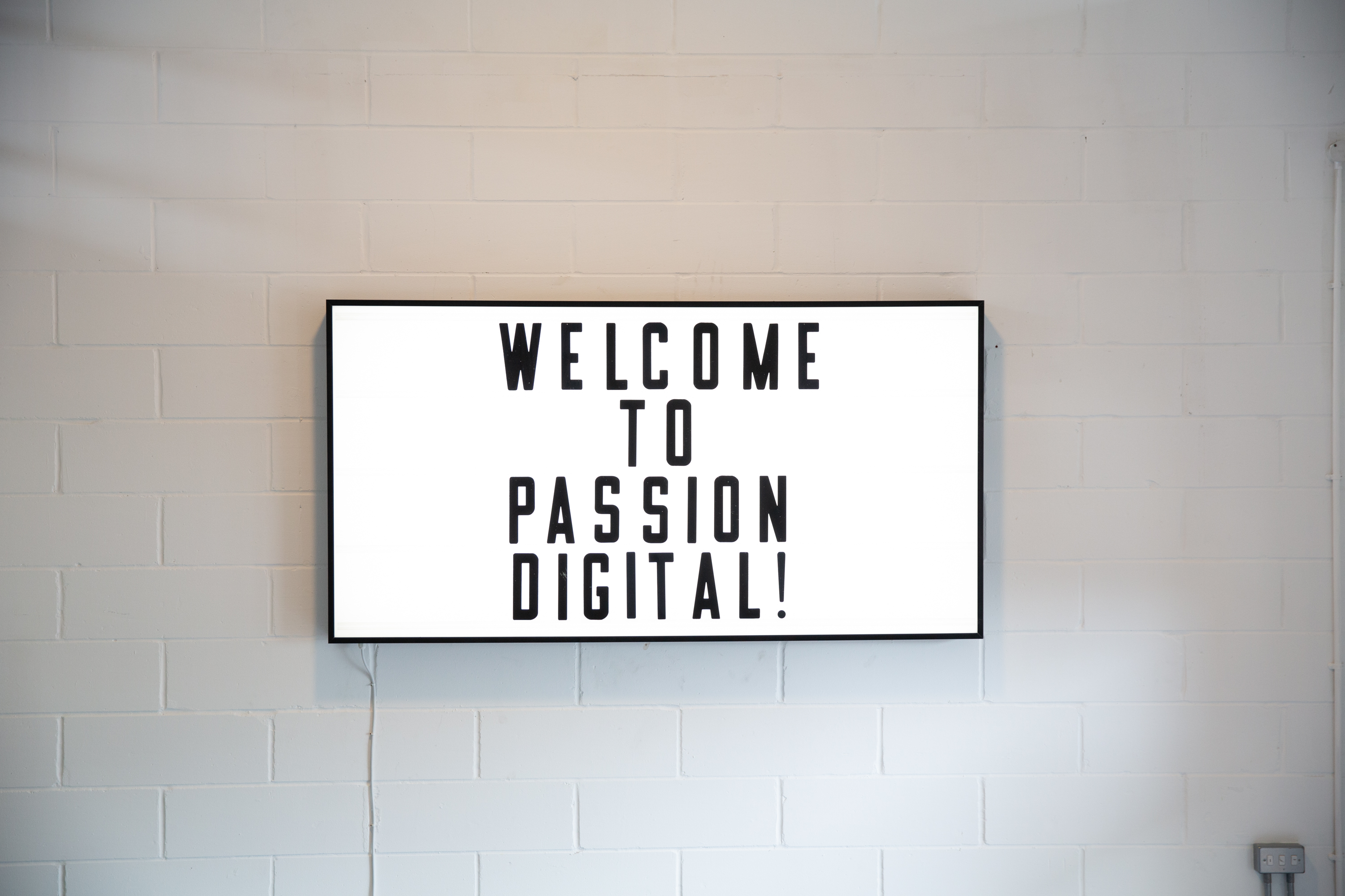 Sleek digital display at Whole Mezzanine, Union Court for professional event welcome.