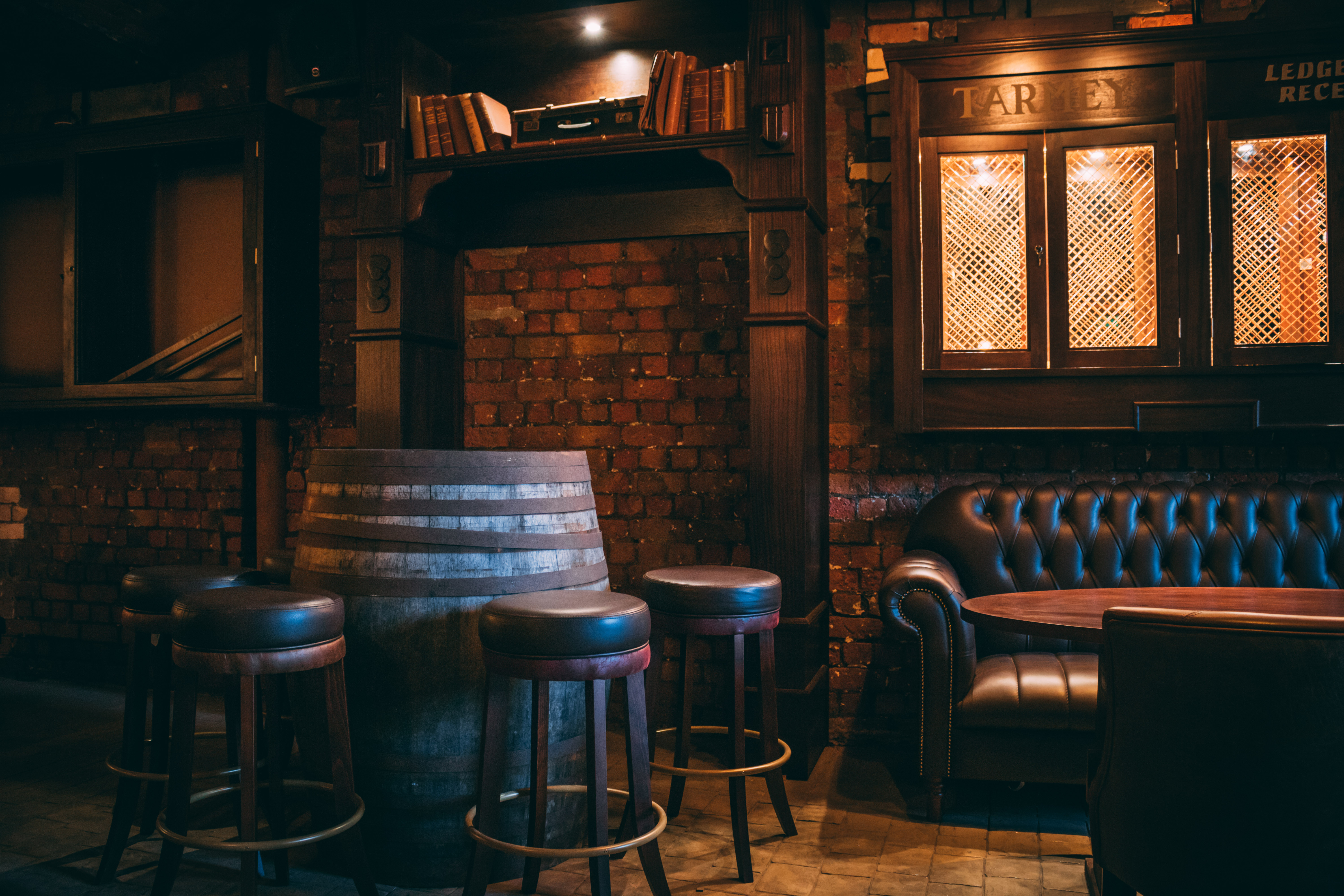 Cozy rustic venue Snug in Punch Tarmey's Liverpool for intimate gatherings and meetings.