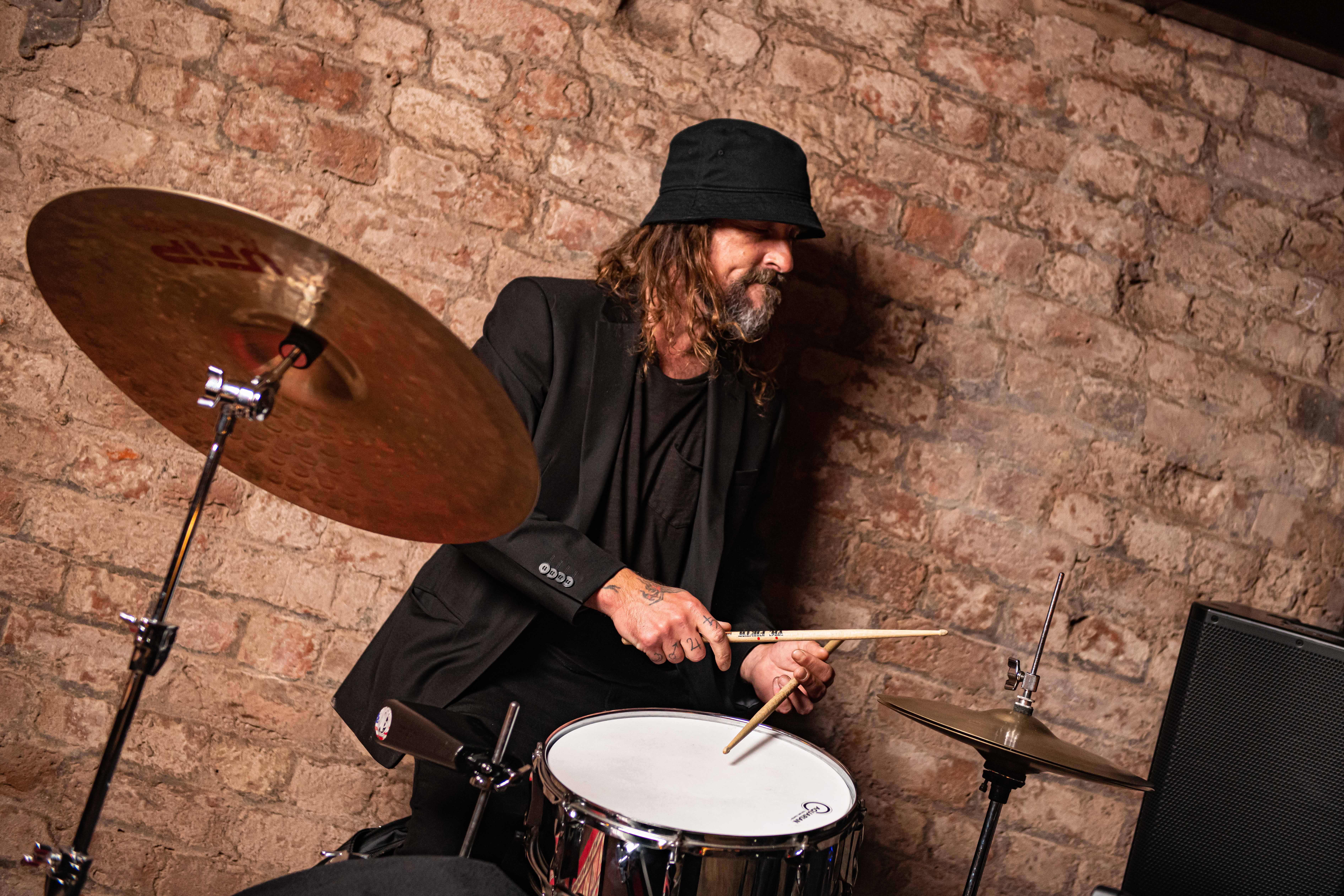 Drummer performing live at Punch Tarmey's Liverpool, perfect for events and gatherings.