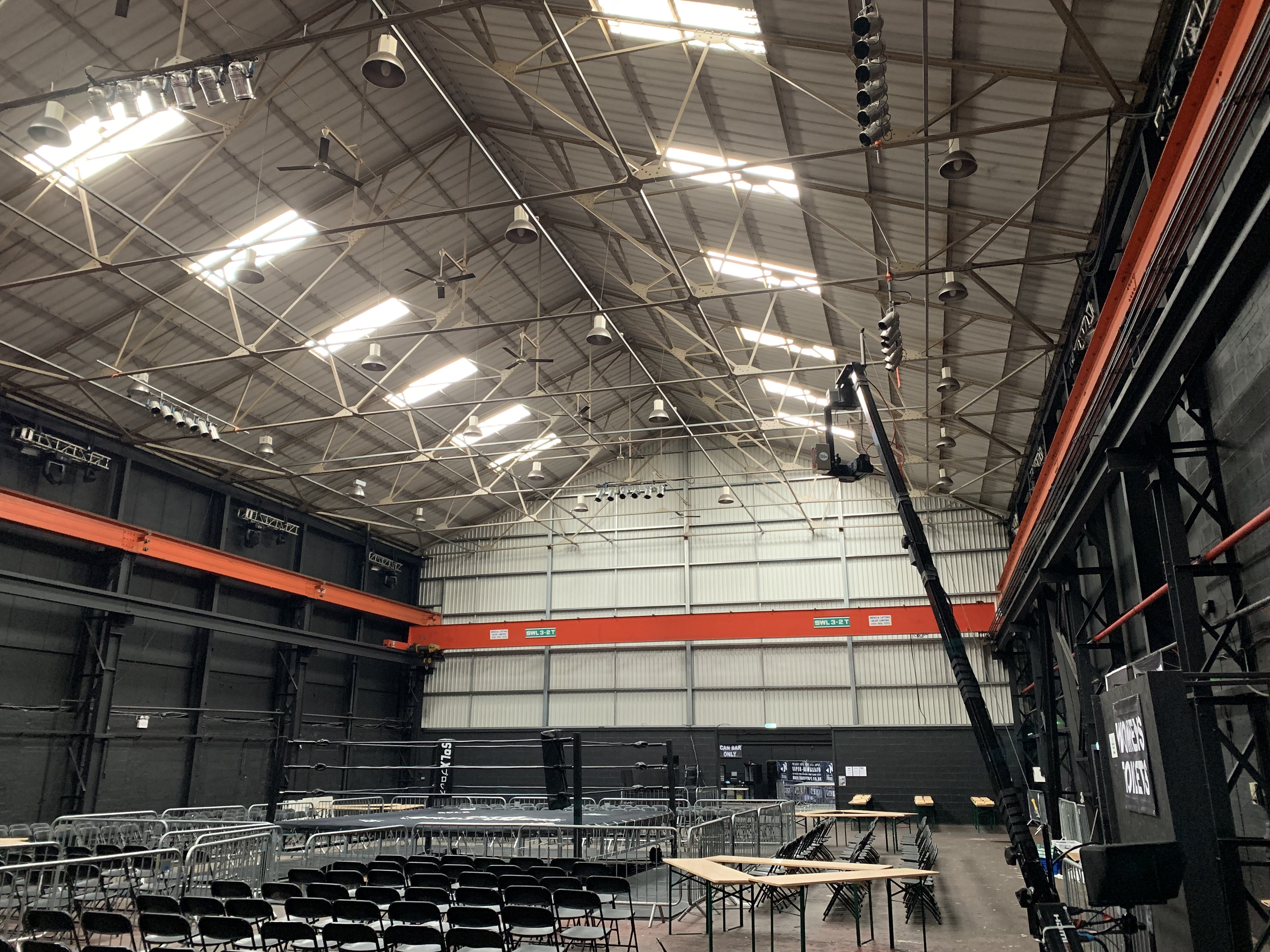 Spacious indoor venue with high ceilings, perfect for concerts and exhibitions.