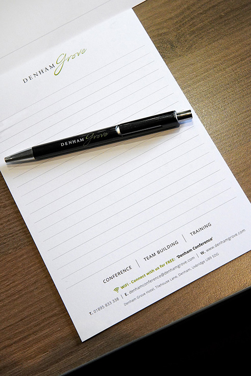 Princess Suite at Denham Grove with branded notepad and pen for meetings and workshops.