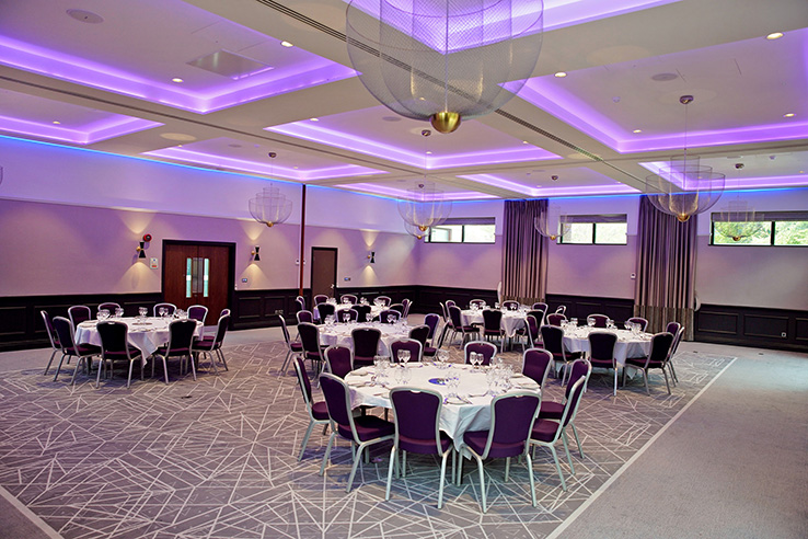 Elegant Princess Suite at Denham Grove for meetings and social gatherings, featuring round tables.
