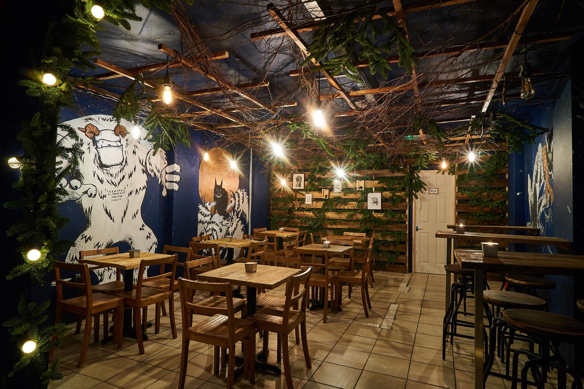 Secret Garden Room in BATCH with rustic tables, ideal for intimate events and gatherings.