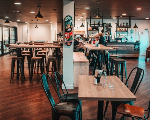 Modern meeting room with bar area at Graystone Action Sports Academy for events and networking.