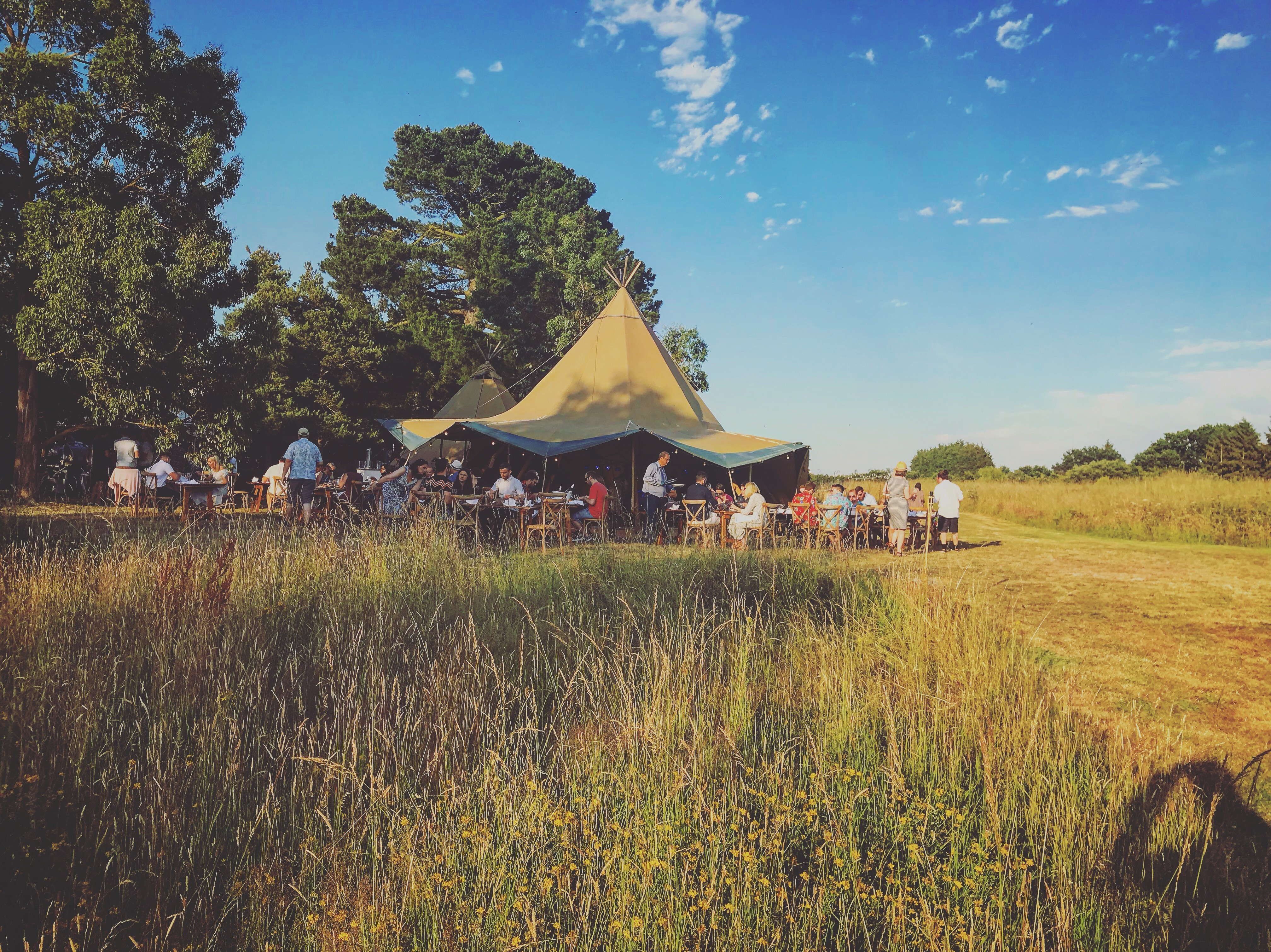Vibrant outdoor event under tent at Lifehouse Spa, ideal for networking and celebrations.
