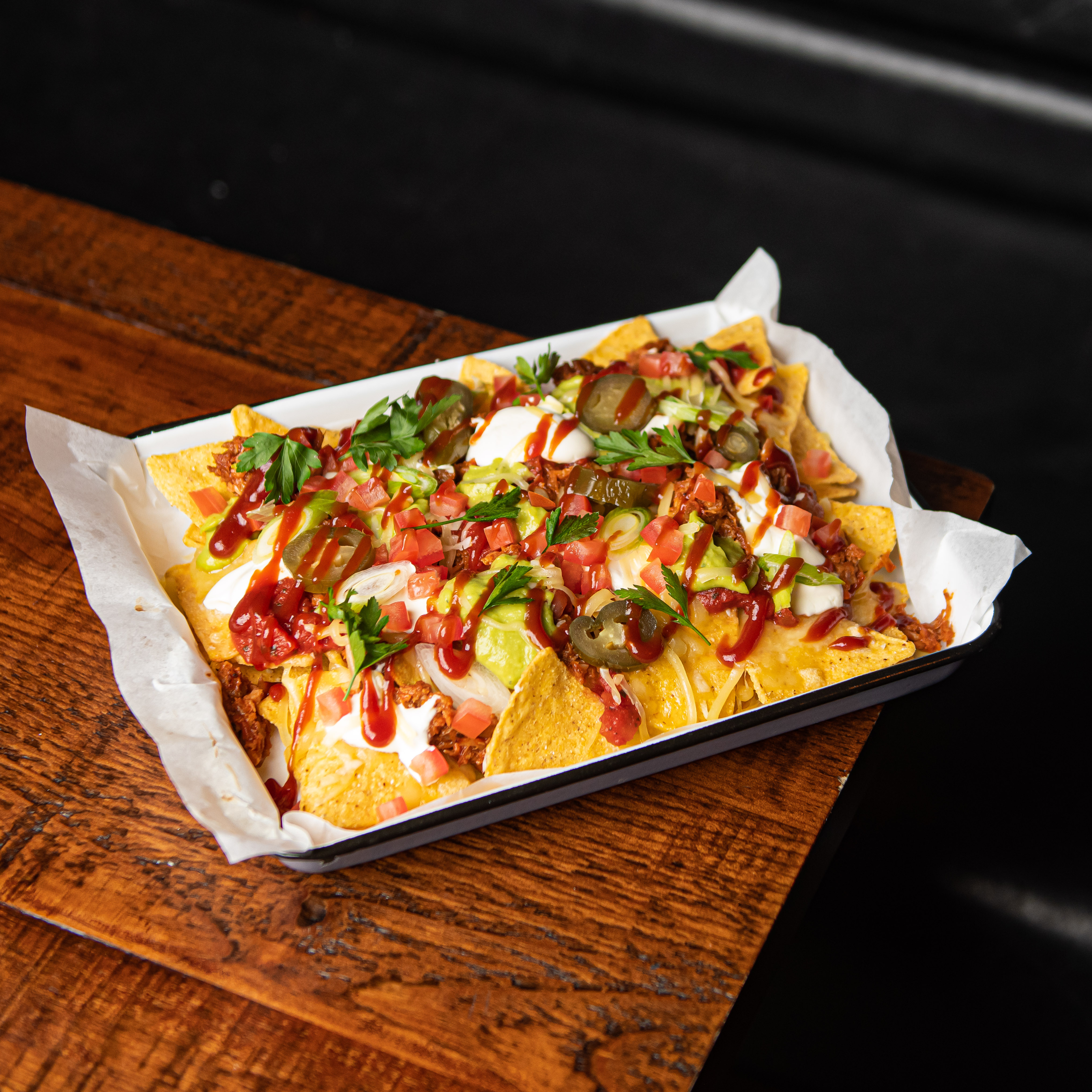 Vibrant nachos platter at Brewery Hall, perfect for casual gatherings and networking events.